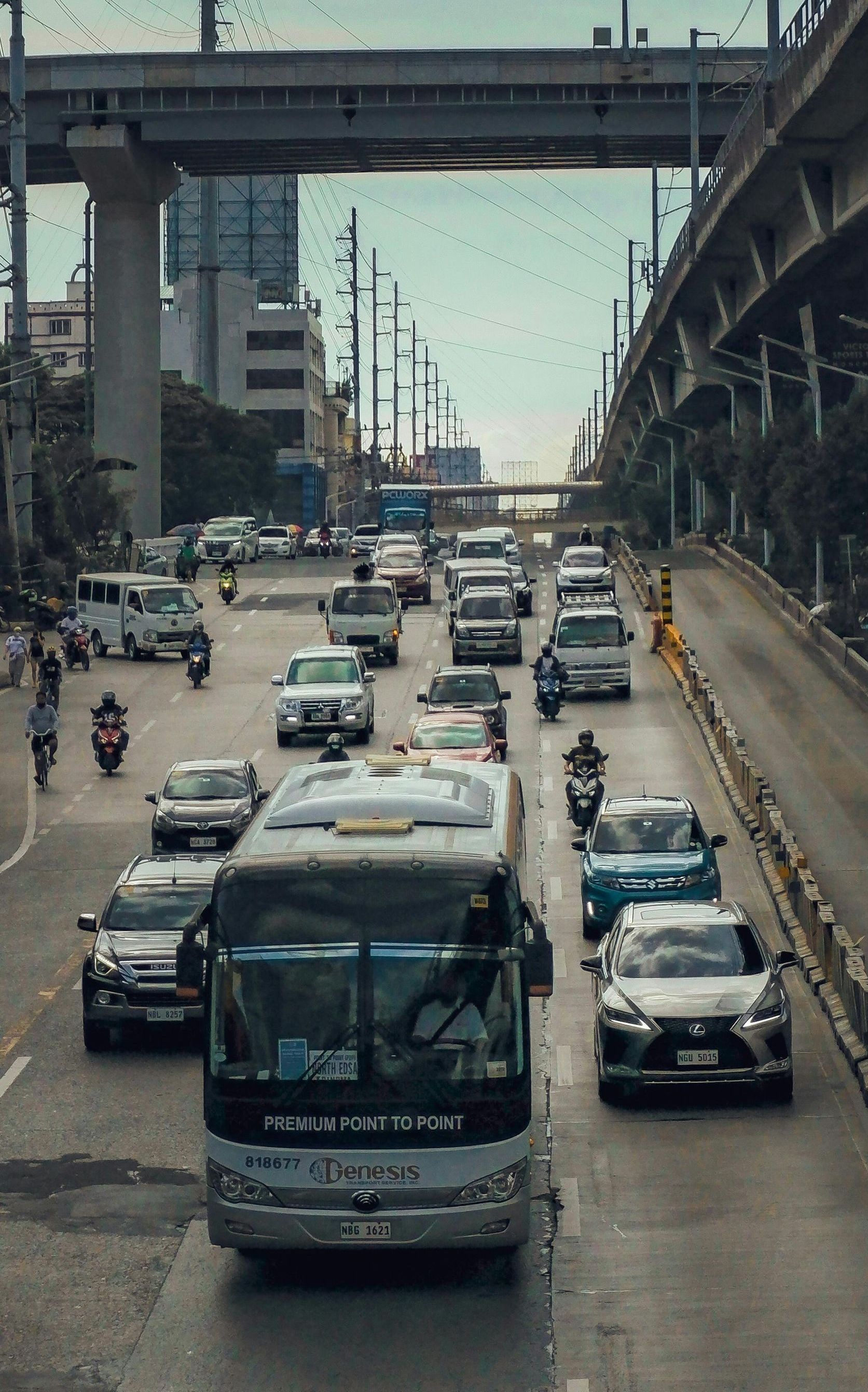 A bus is driving down a busy city street.