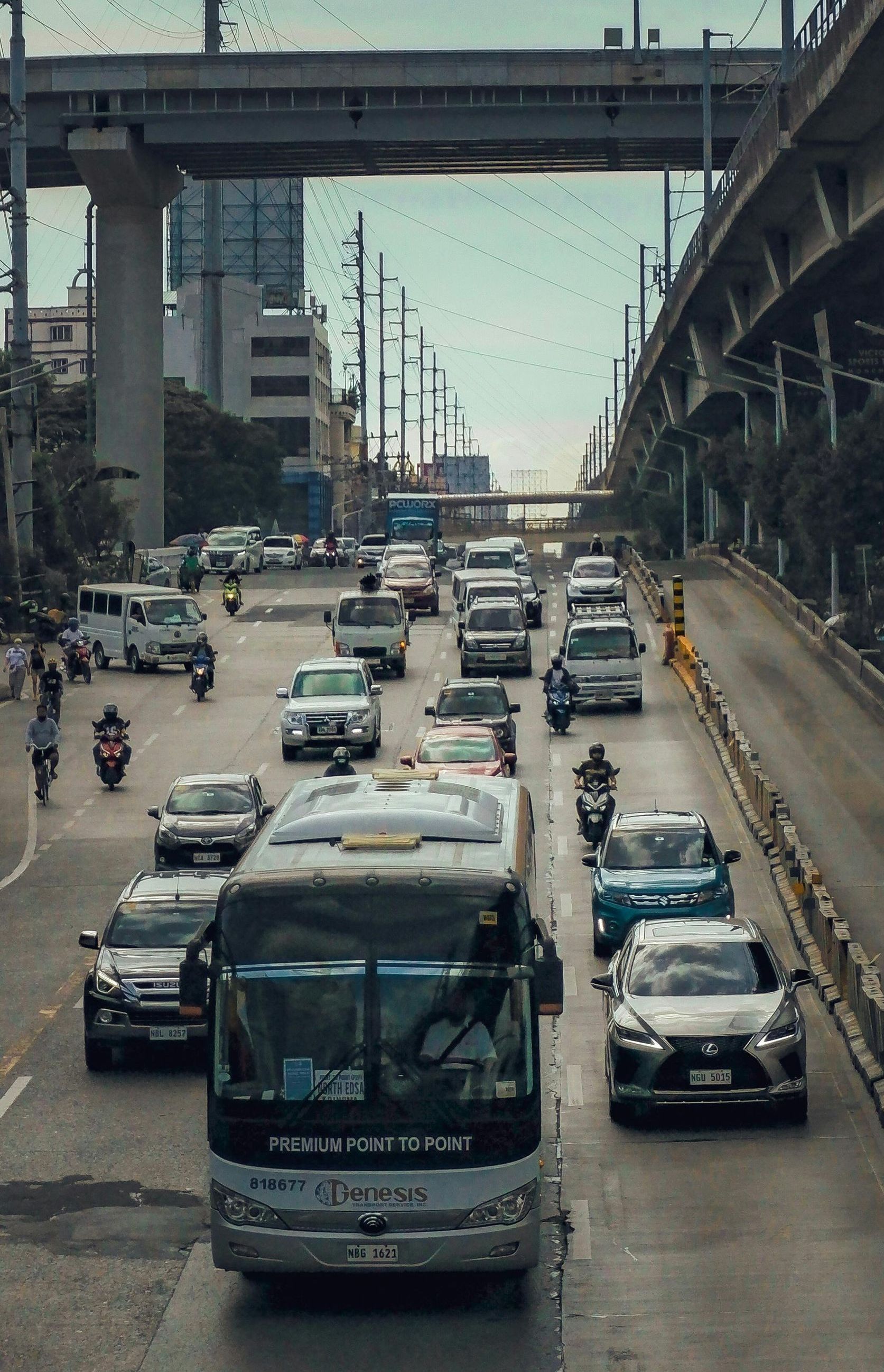 A bus is driving down a busy city street.