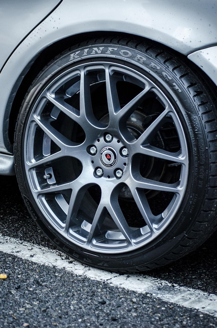 A close up of a car wheel with a tire on it