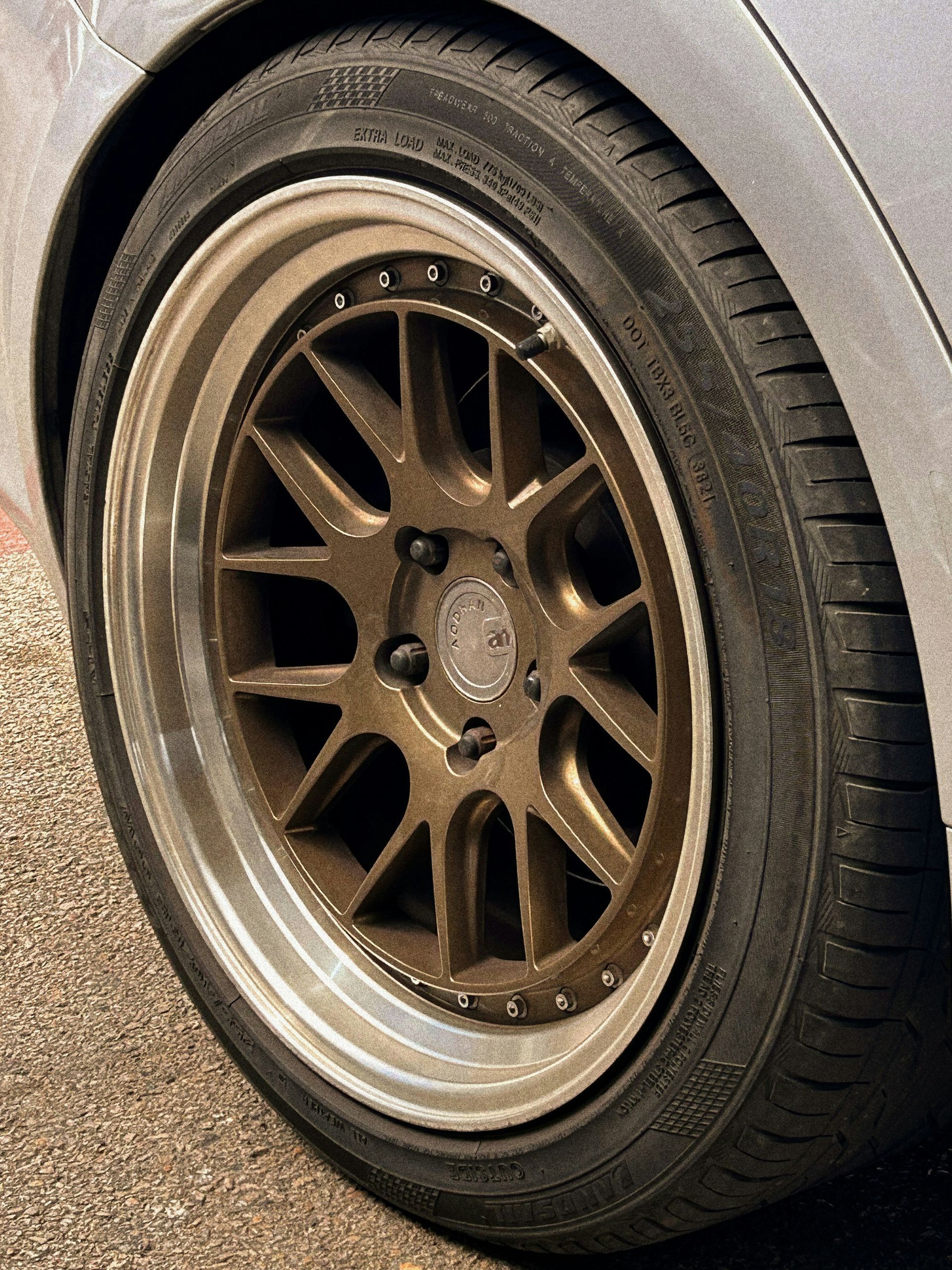 A close up of a car wheel with a tire on it