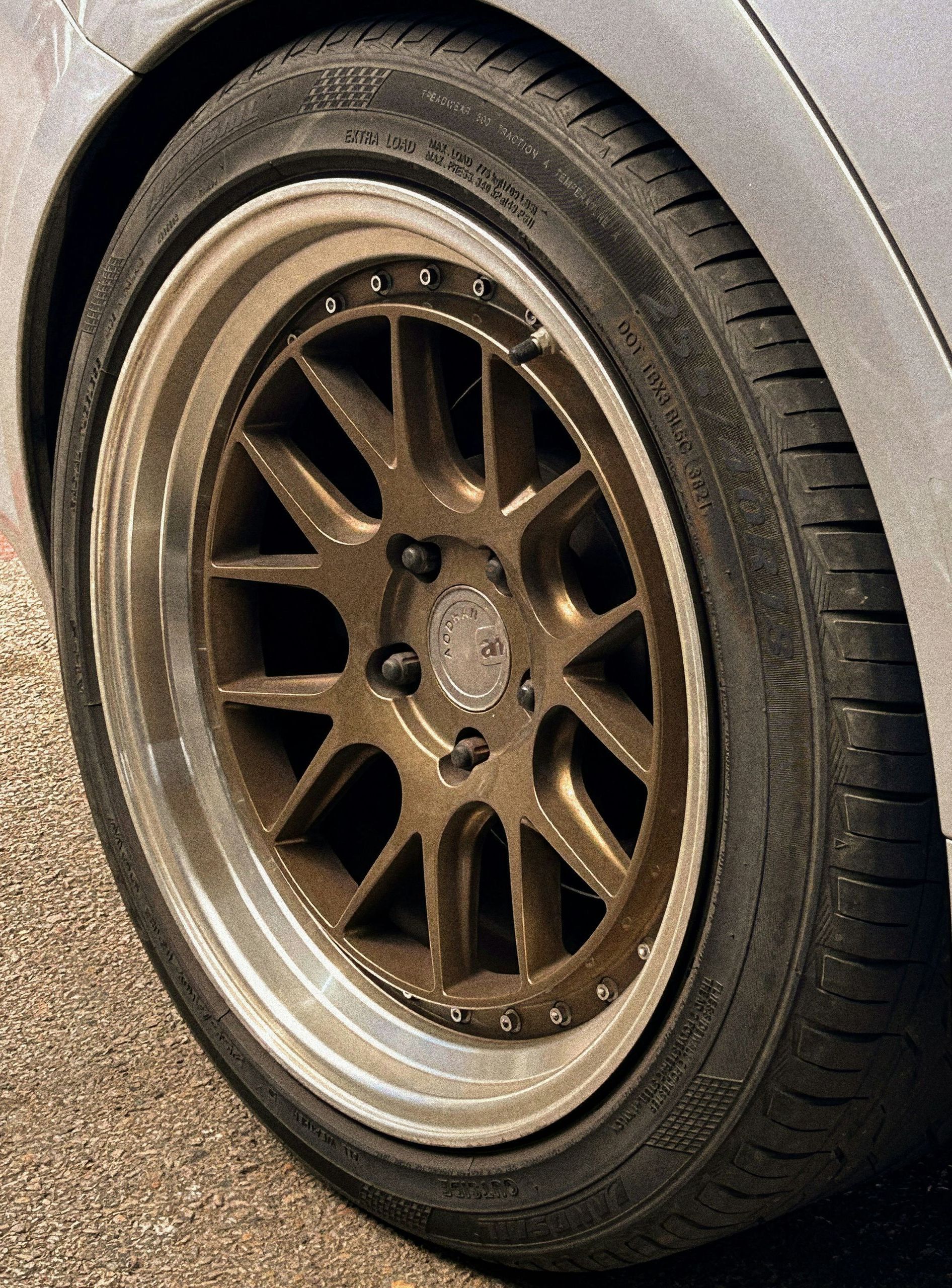 A close up of a car wheel with a tire on it