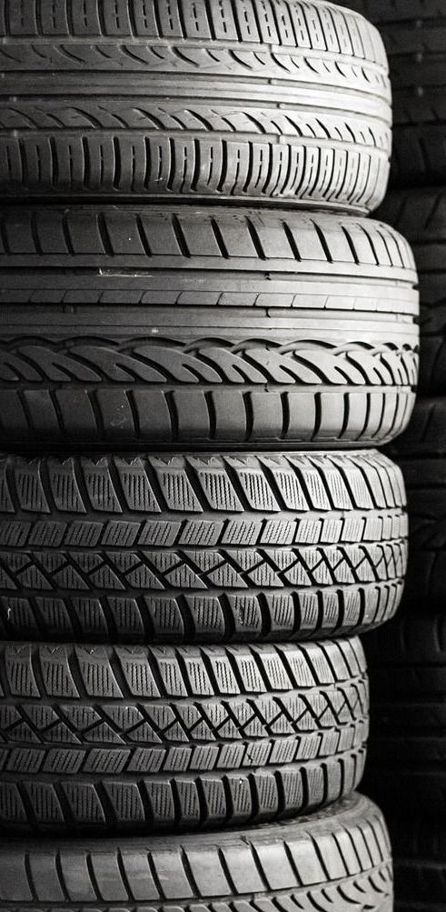 Stack of tires in black and white.