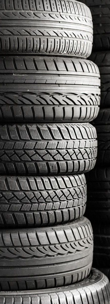 A stack of tires are stacked on top of each other.