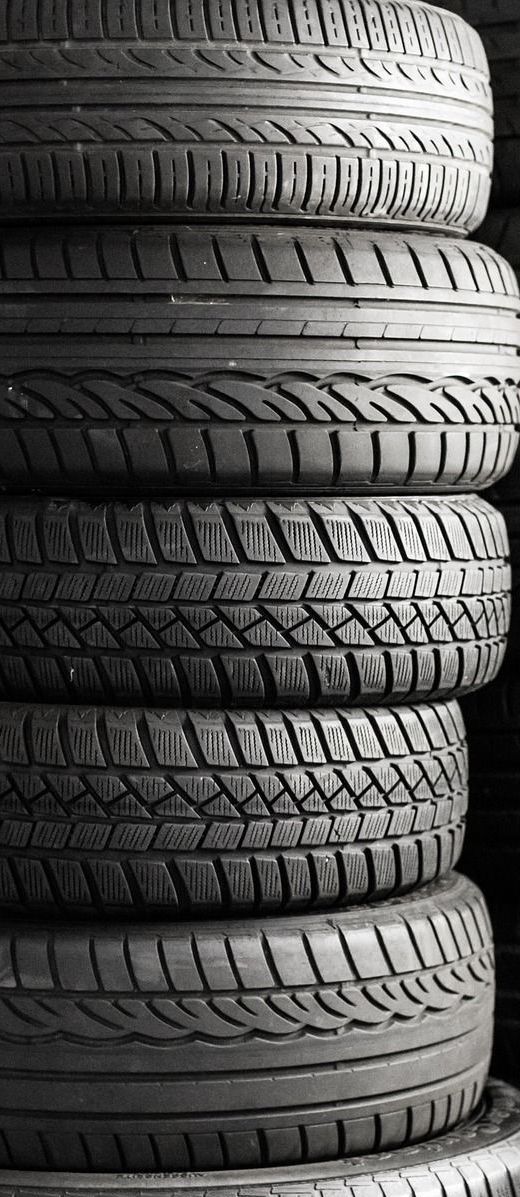A stack of tires are stacked on top of each other.