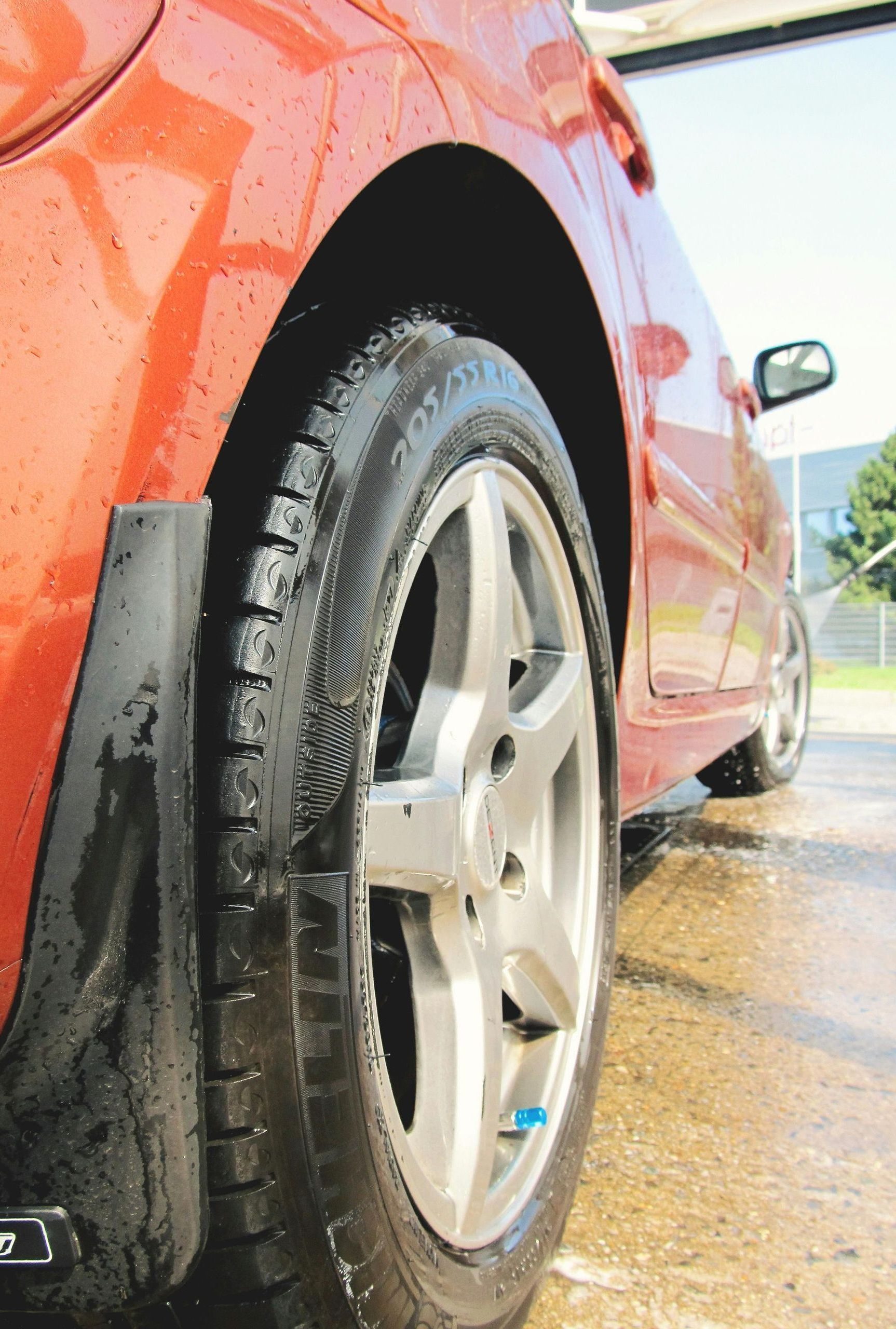 A close up of a car wheel and tire