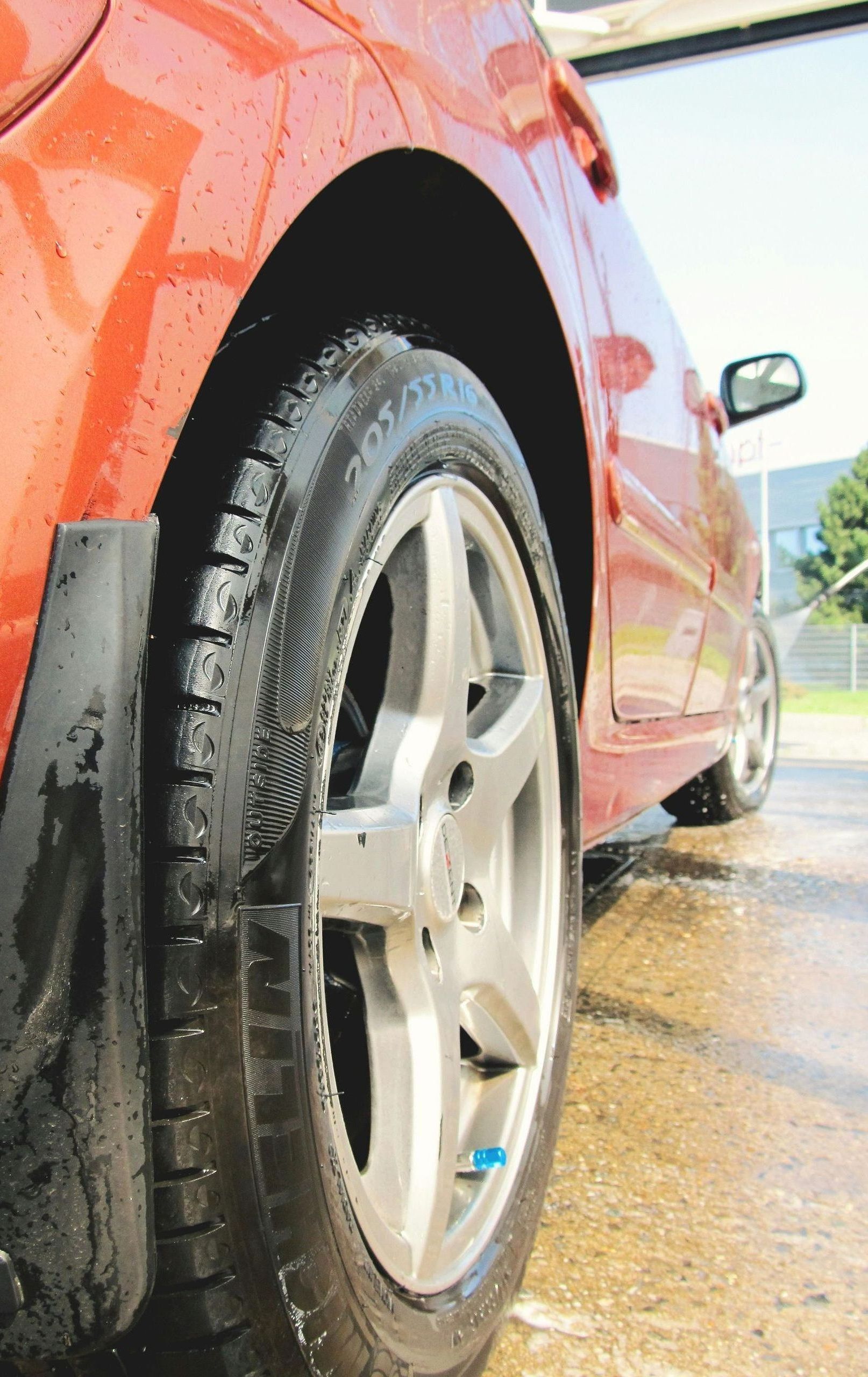 A close up of a car wheel and tire