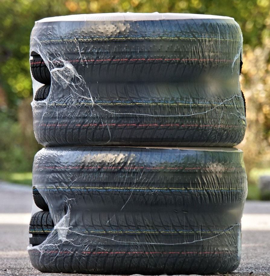 A close up of a tire on a white truck