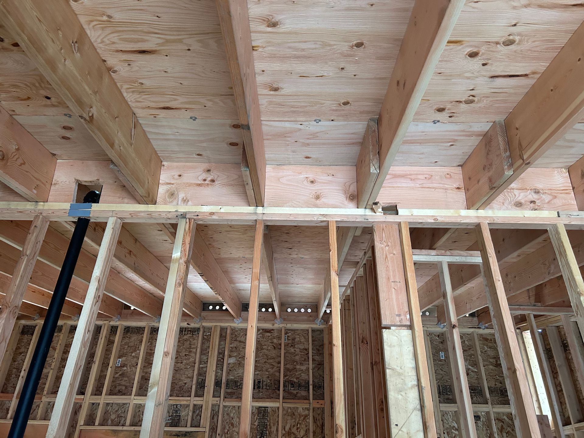 A house is being built and the ceiling is made of wood.