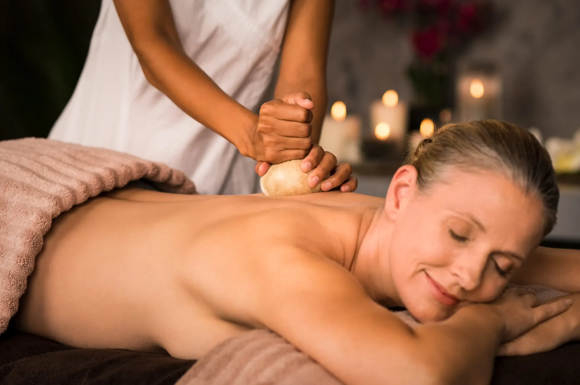 a woman is getting a massage at a spa .