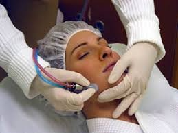Girl cleaning face after receiving microdermabrasion treatment from Hot Springs Surgery and Vein