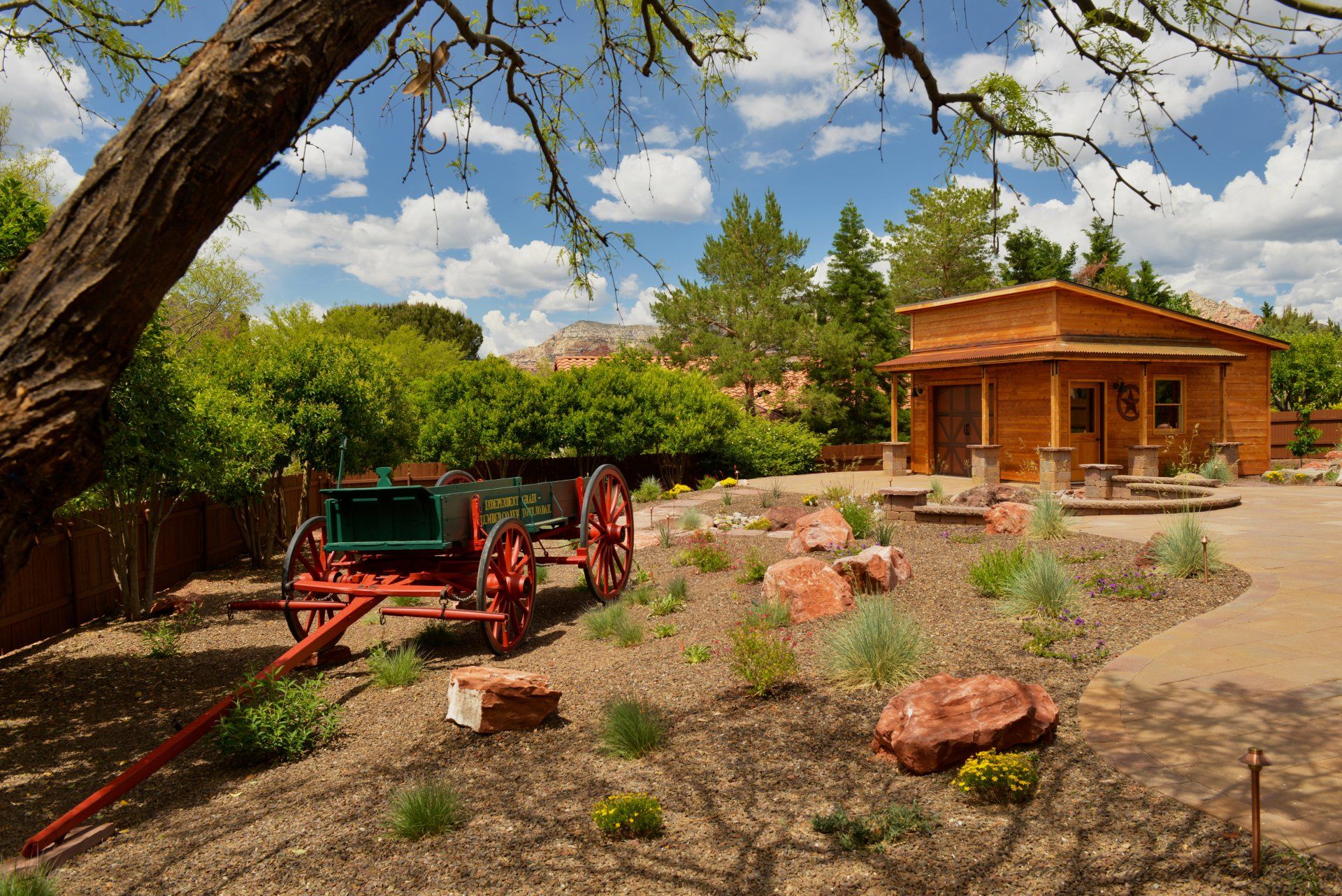 A horse drawn carriage is parked in front of a house.