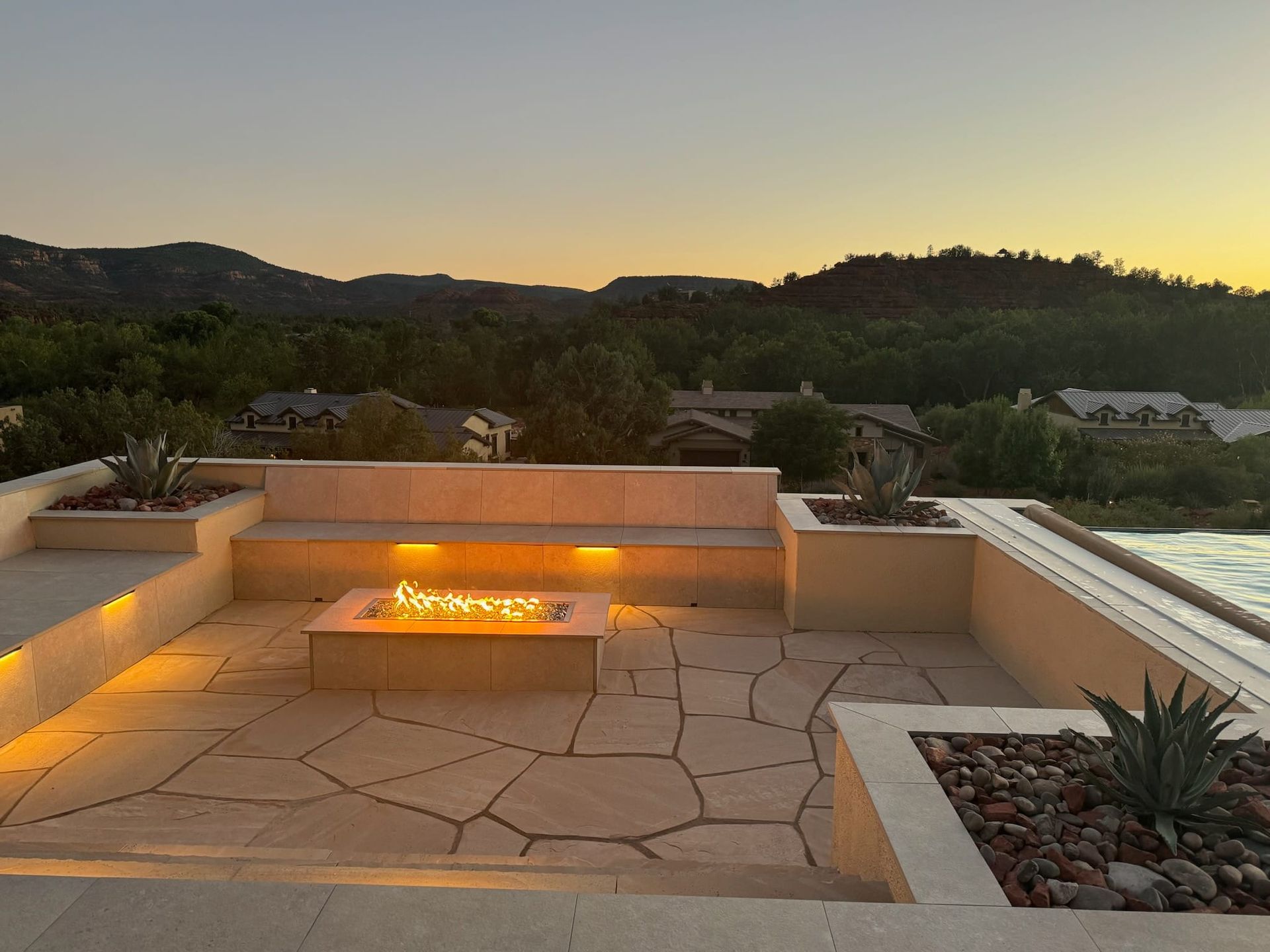 There is a fire pit on the roof of a building.