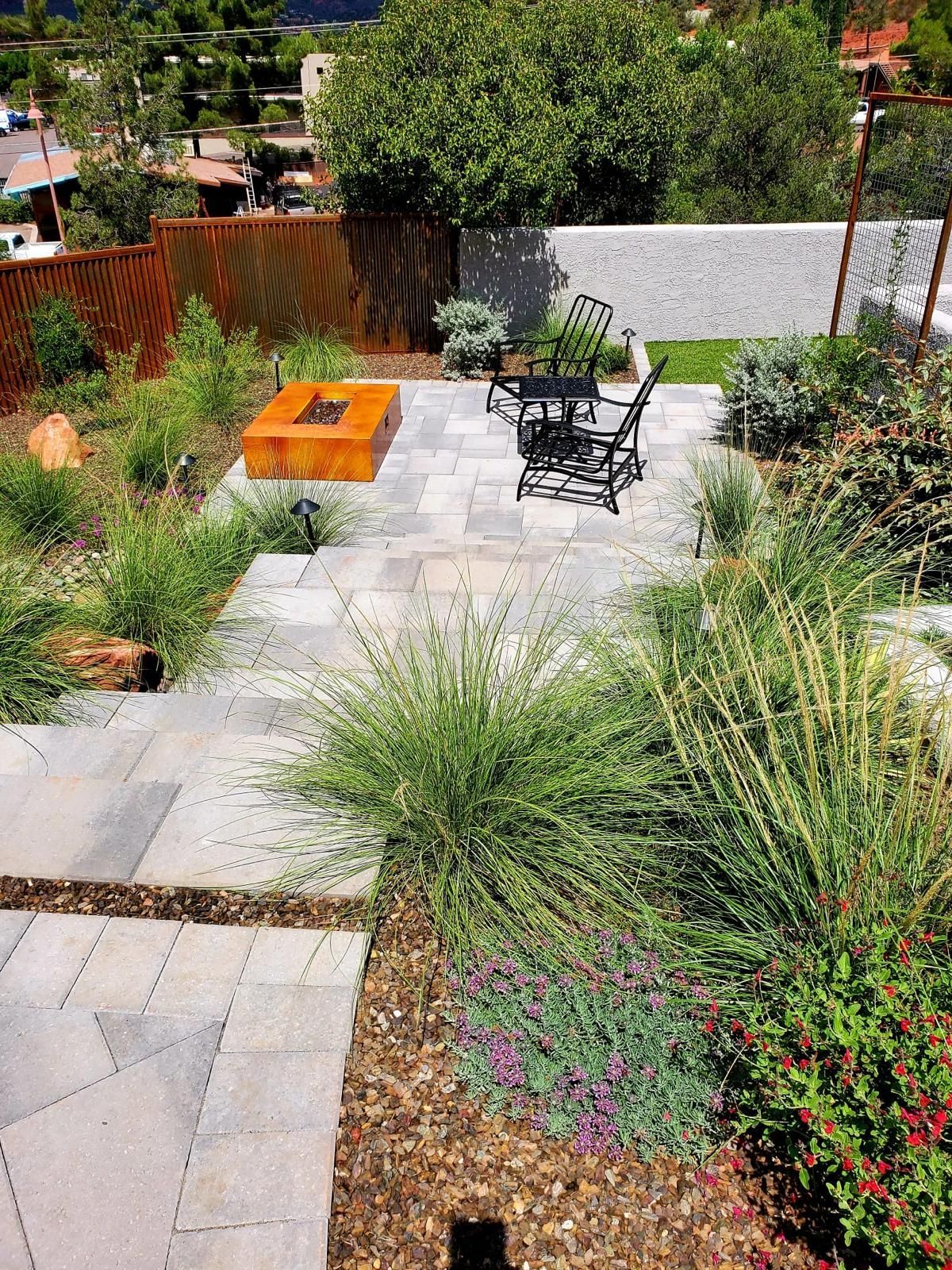 There is a fire pit in the middle of the garden.