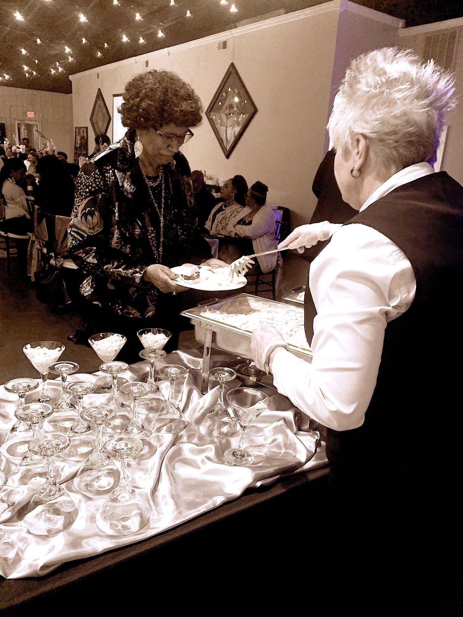 female caterer serving in a buffet line