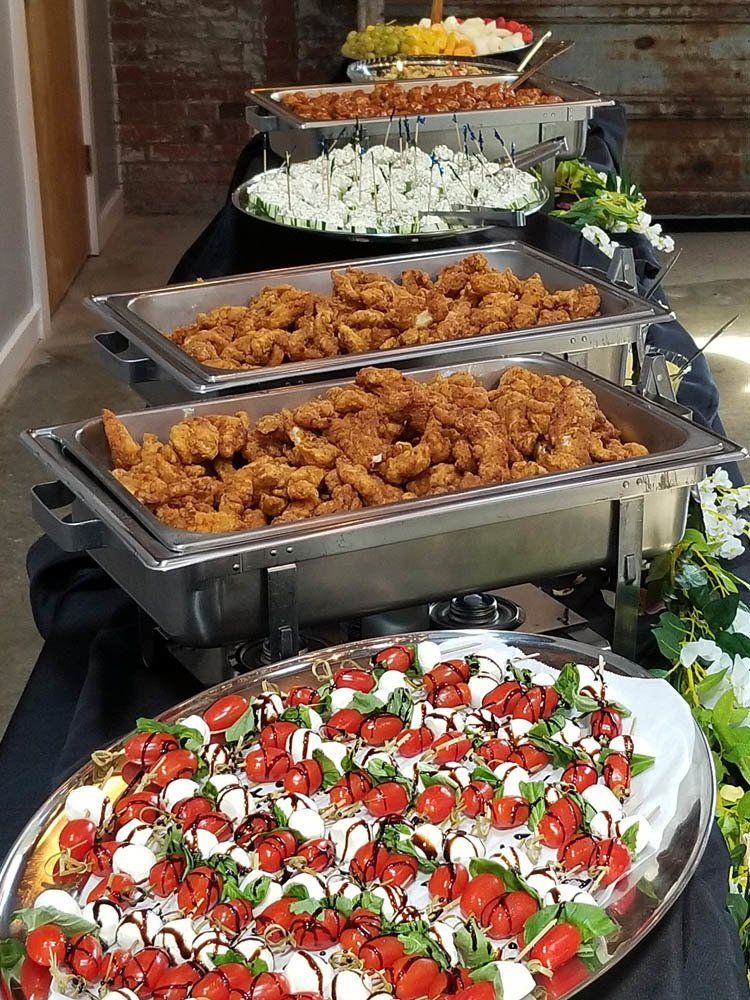 a buffet table filled with food ready for guests