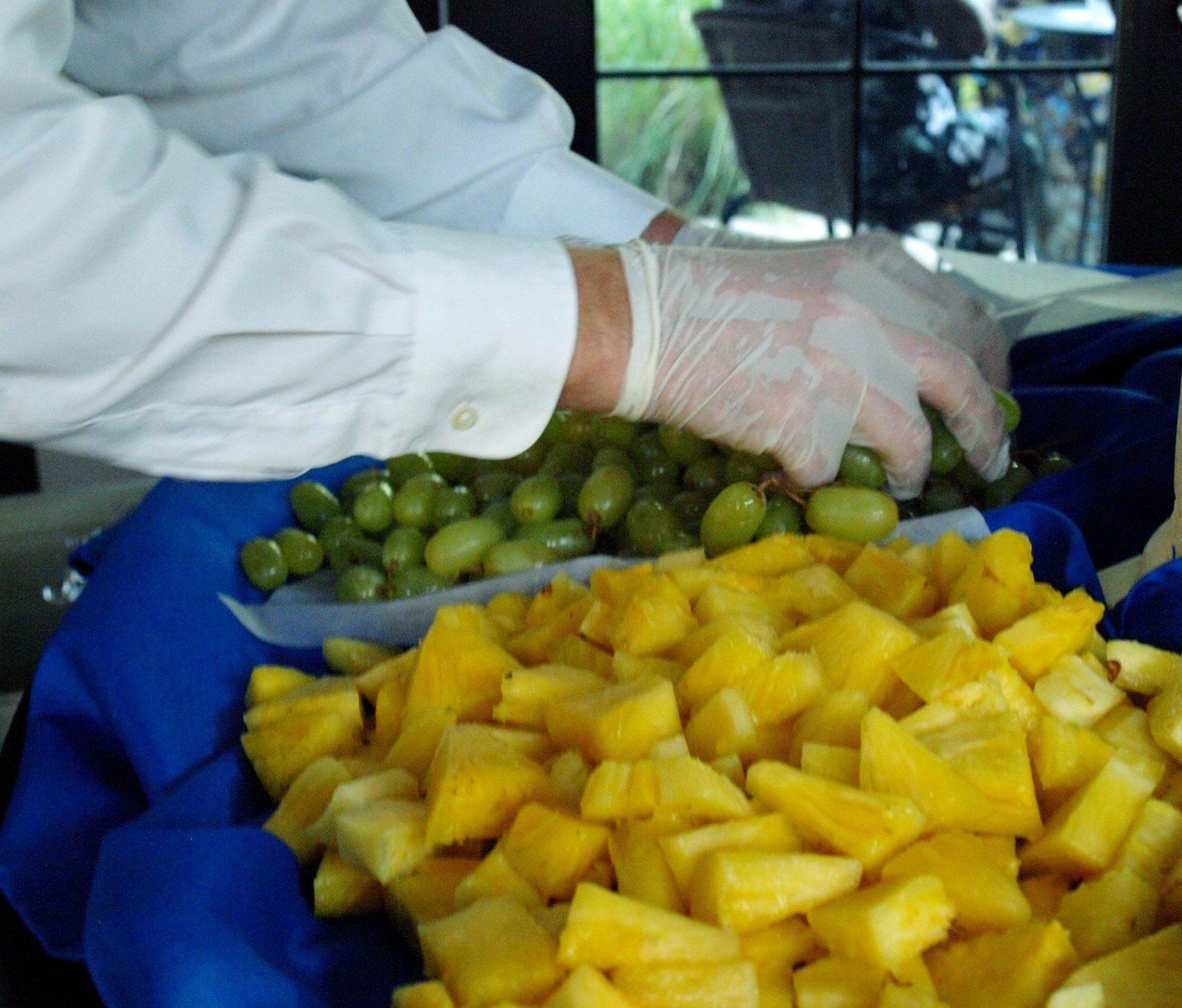 caterer setting up fruit display