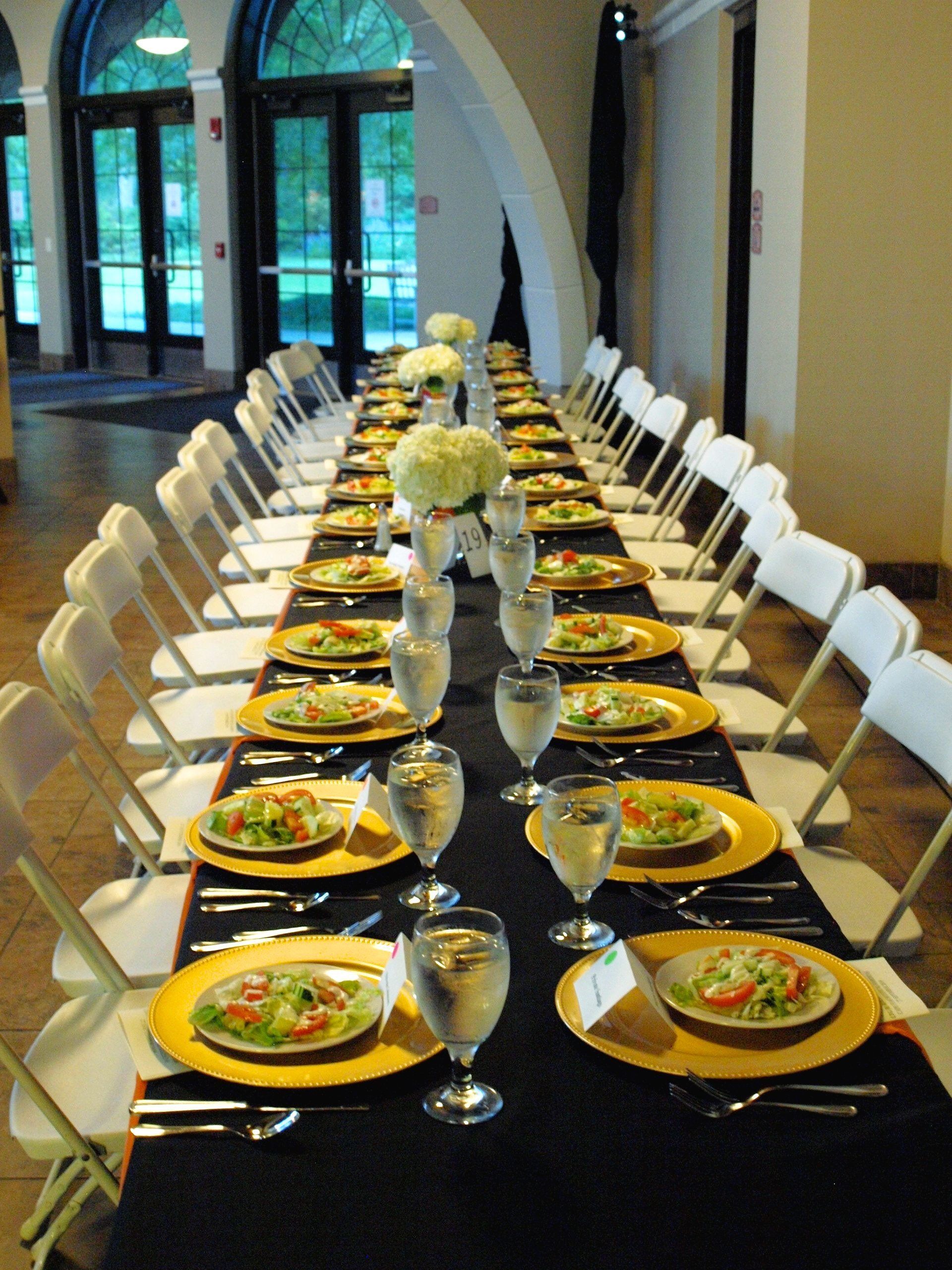 long table set up with plated salads at the Botanical Gardens venue