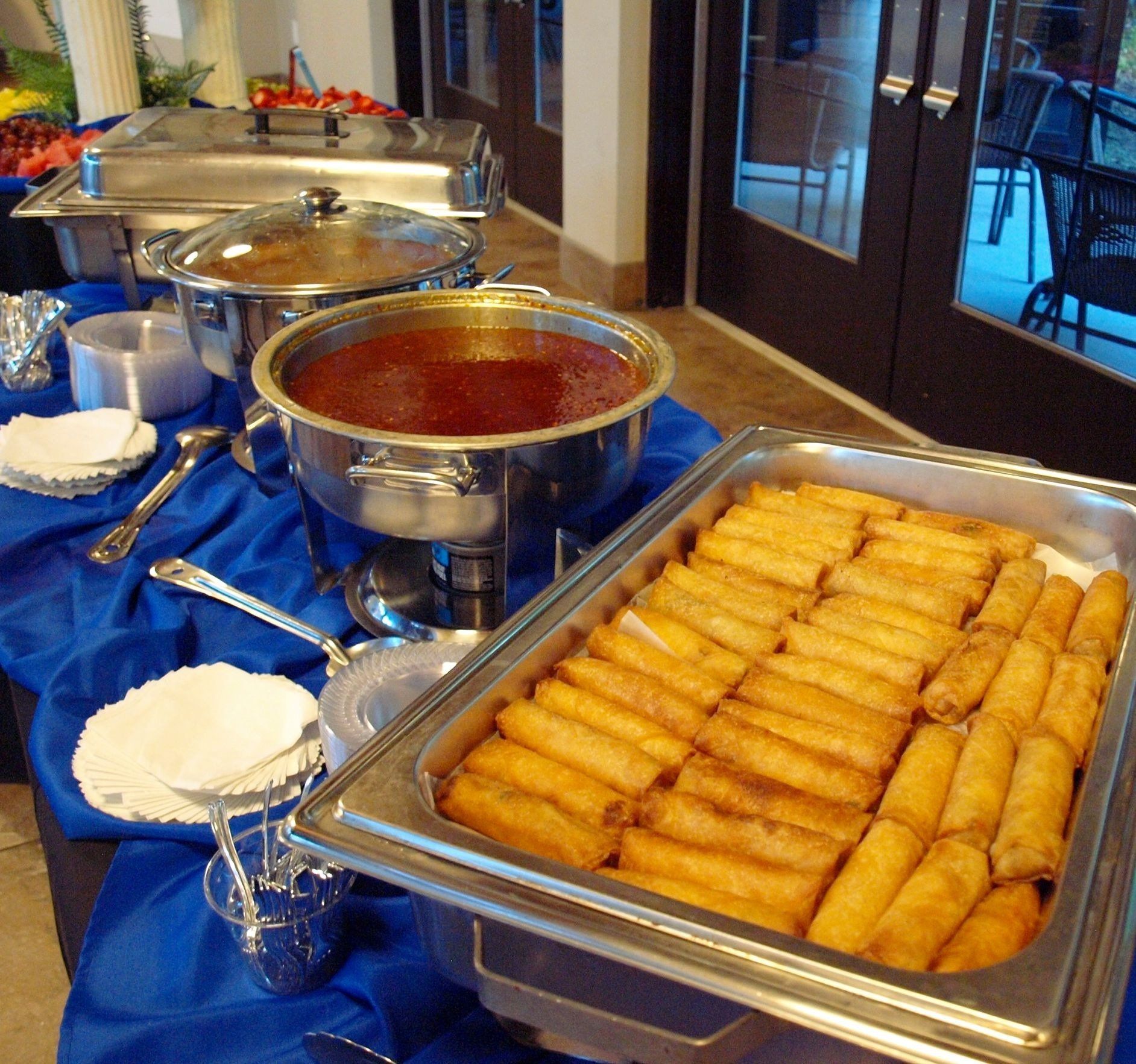 buffet pan with egg rolls and chafing dish with dippy sauce