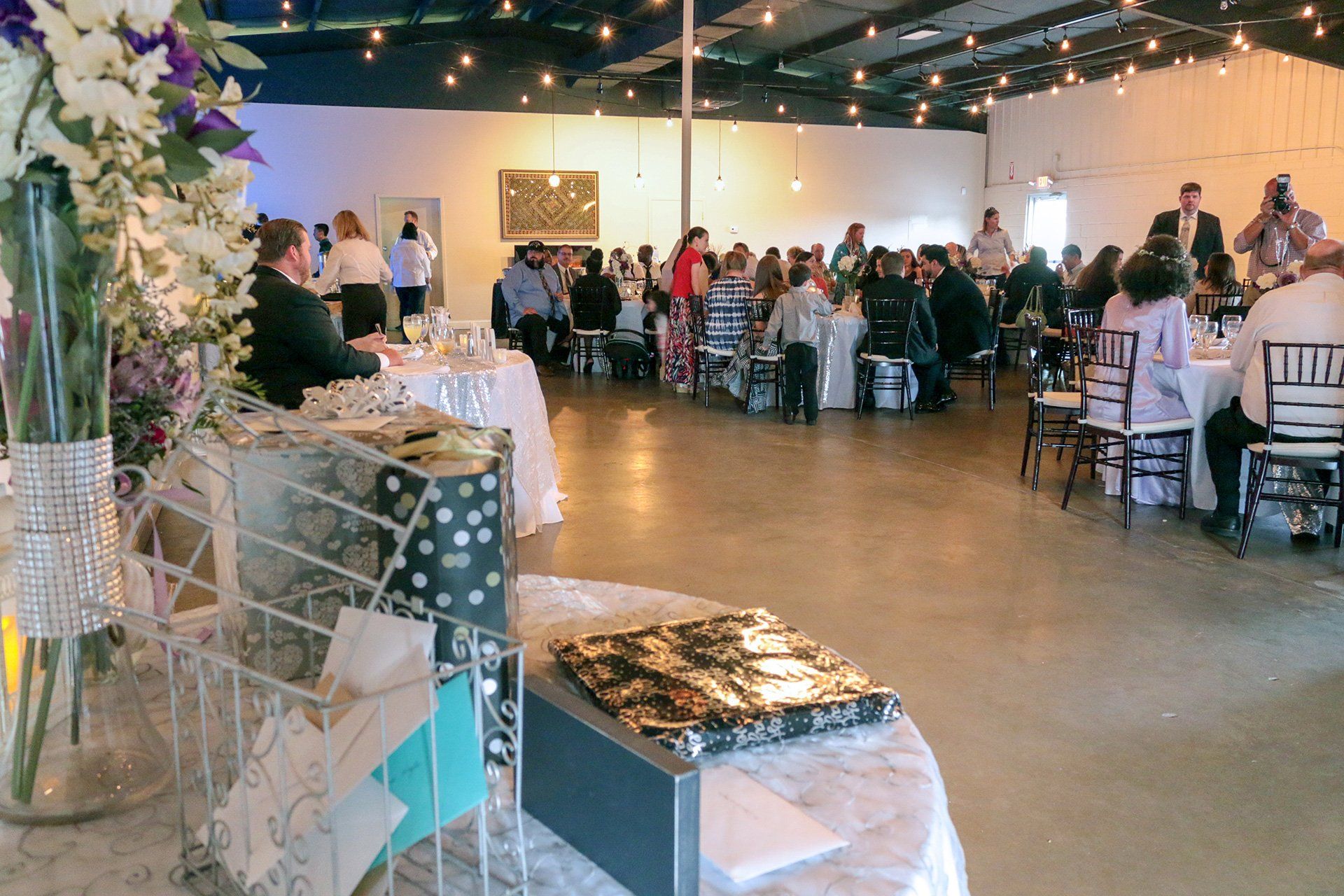 gift table with tall floral centerpiece