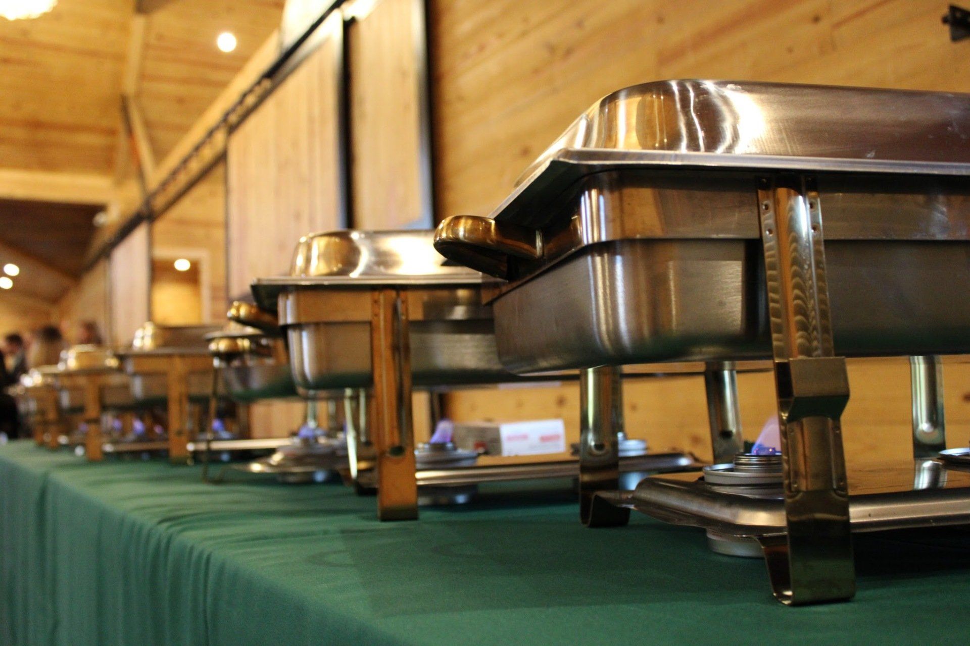 covered buffet pans line up on buffet table