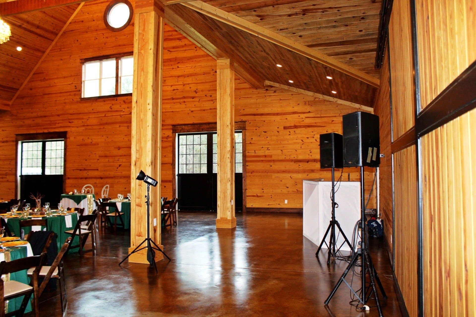 dj stand and speakers set up at the Carolina Barn venue