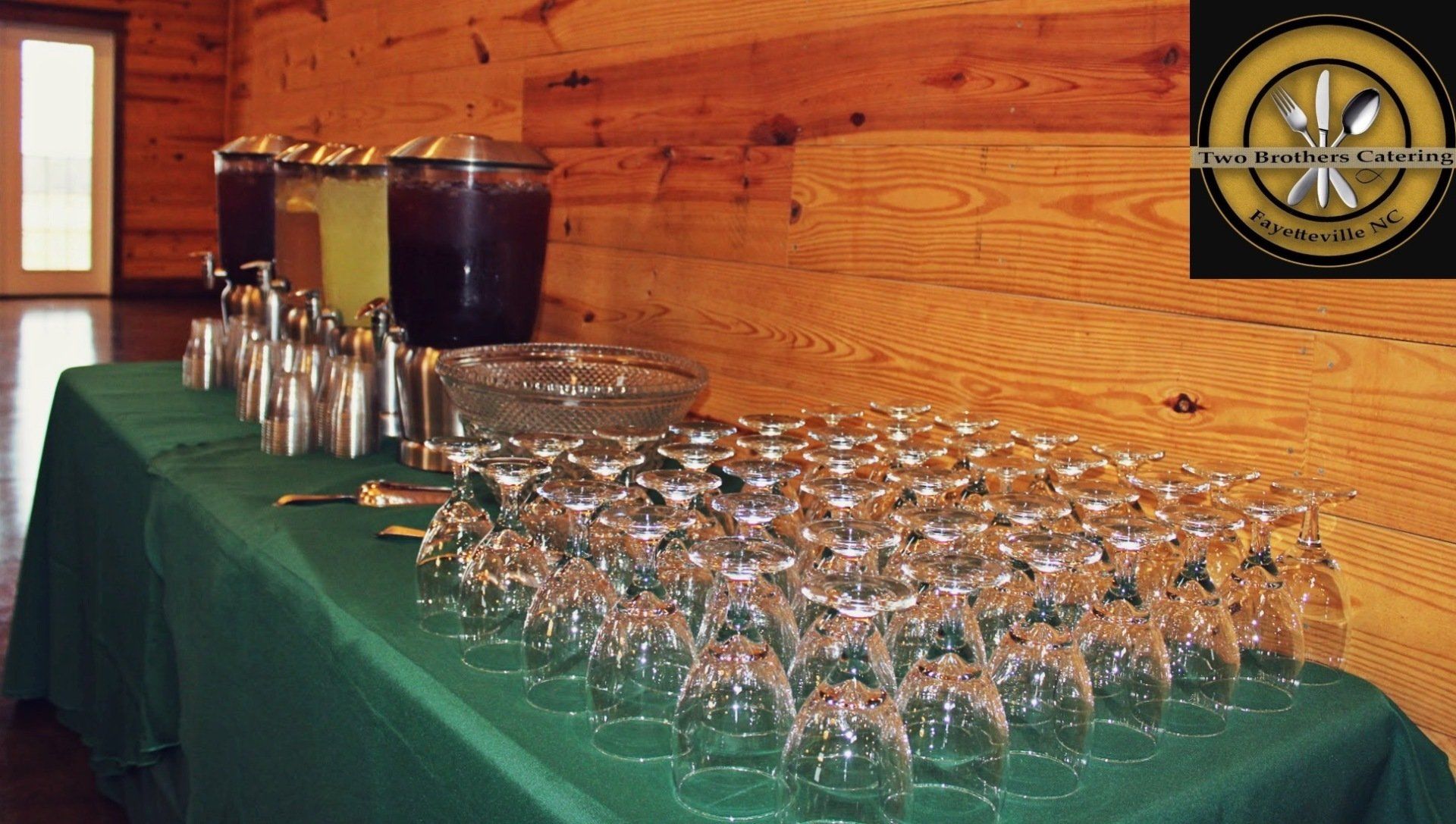 glasses and beferage jars set up on drink table