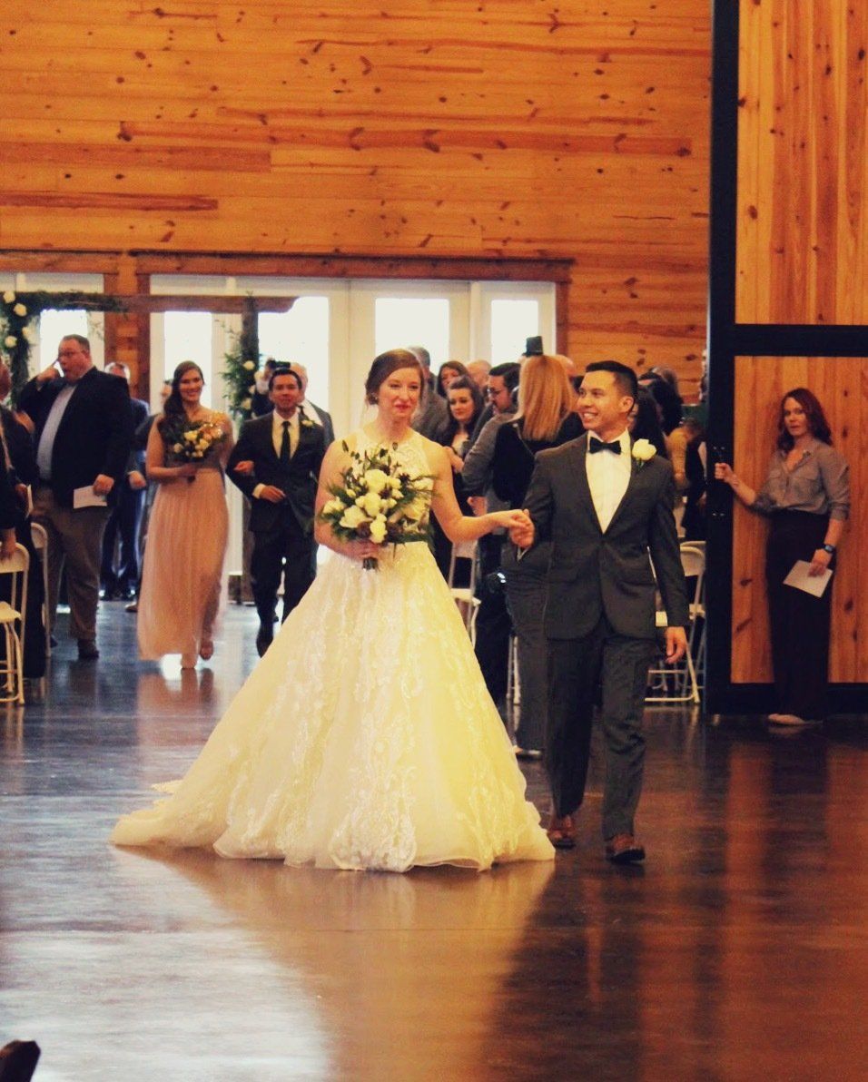wedding couple entering the Carolina Barn venue