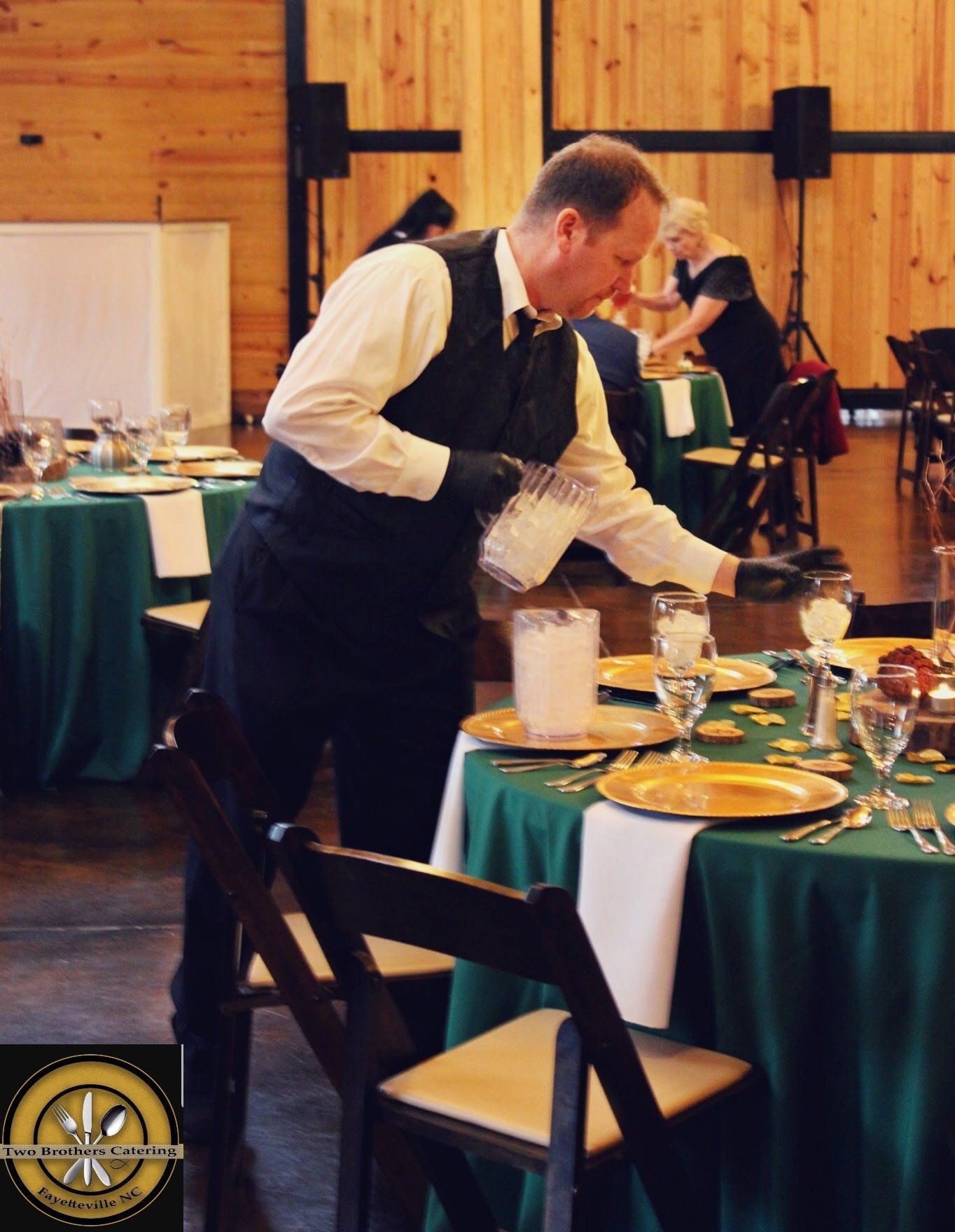 caterer filling water glasses