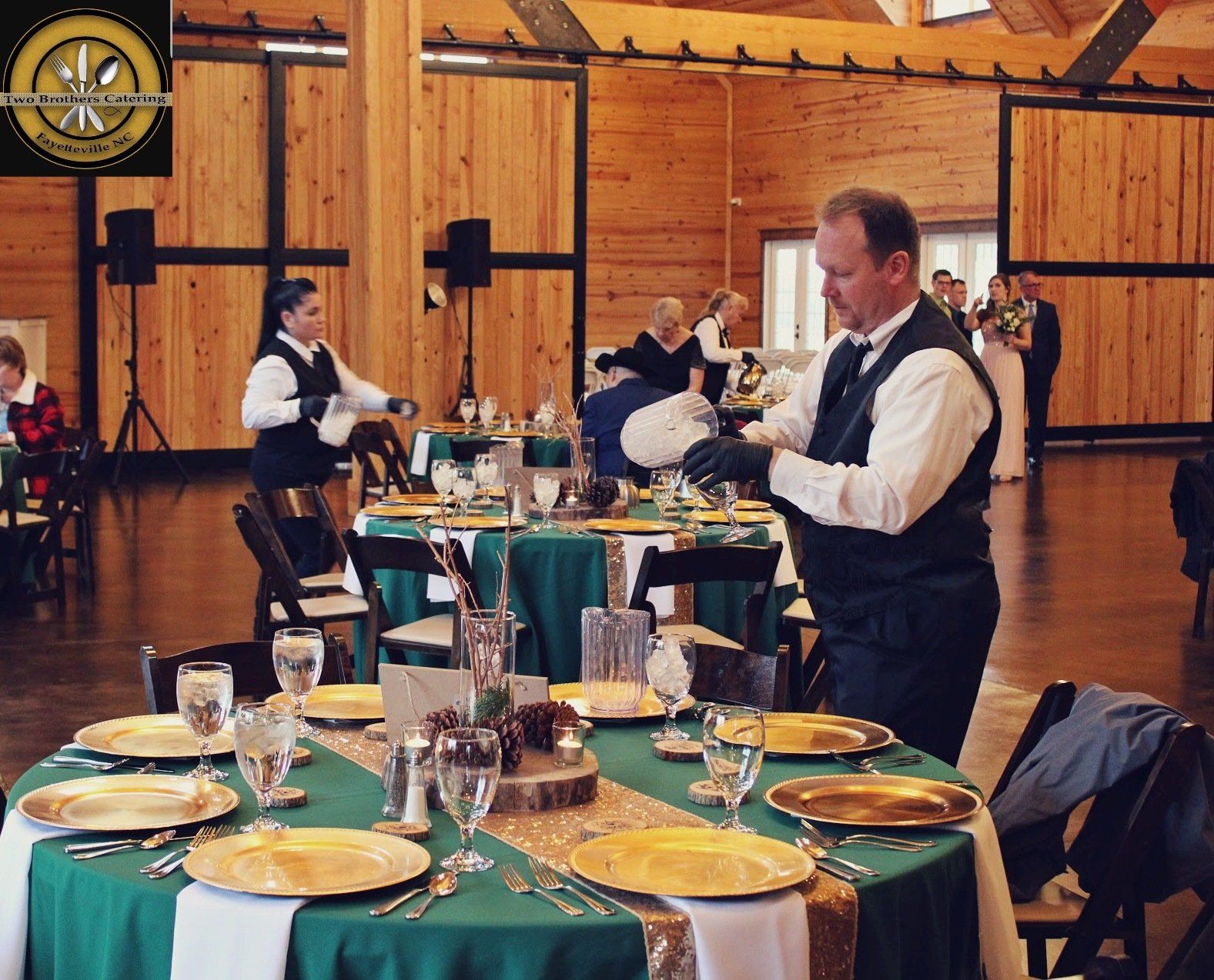 caterers filling water glasses