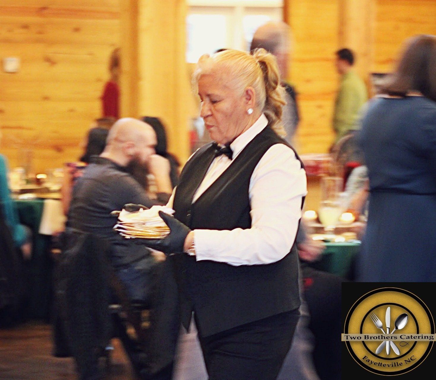 female caterer carrying plates