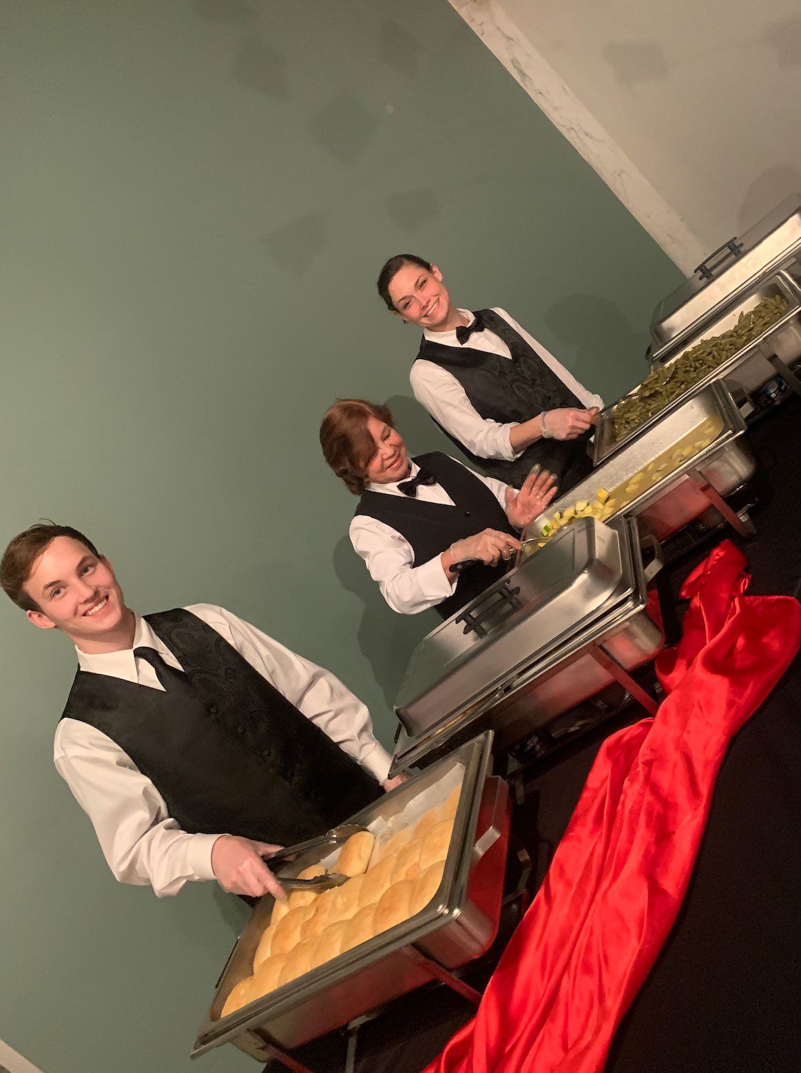 caterers ready to serve at a buffet
