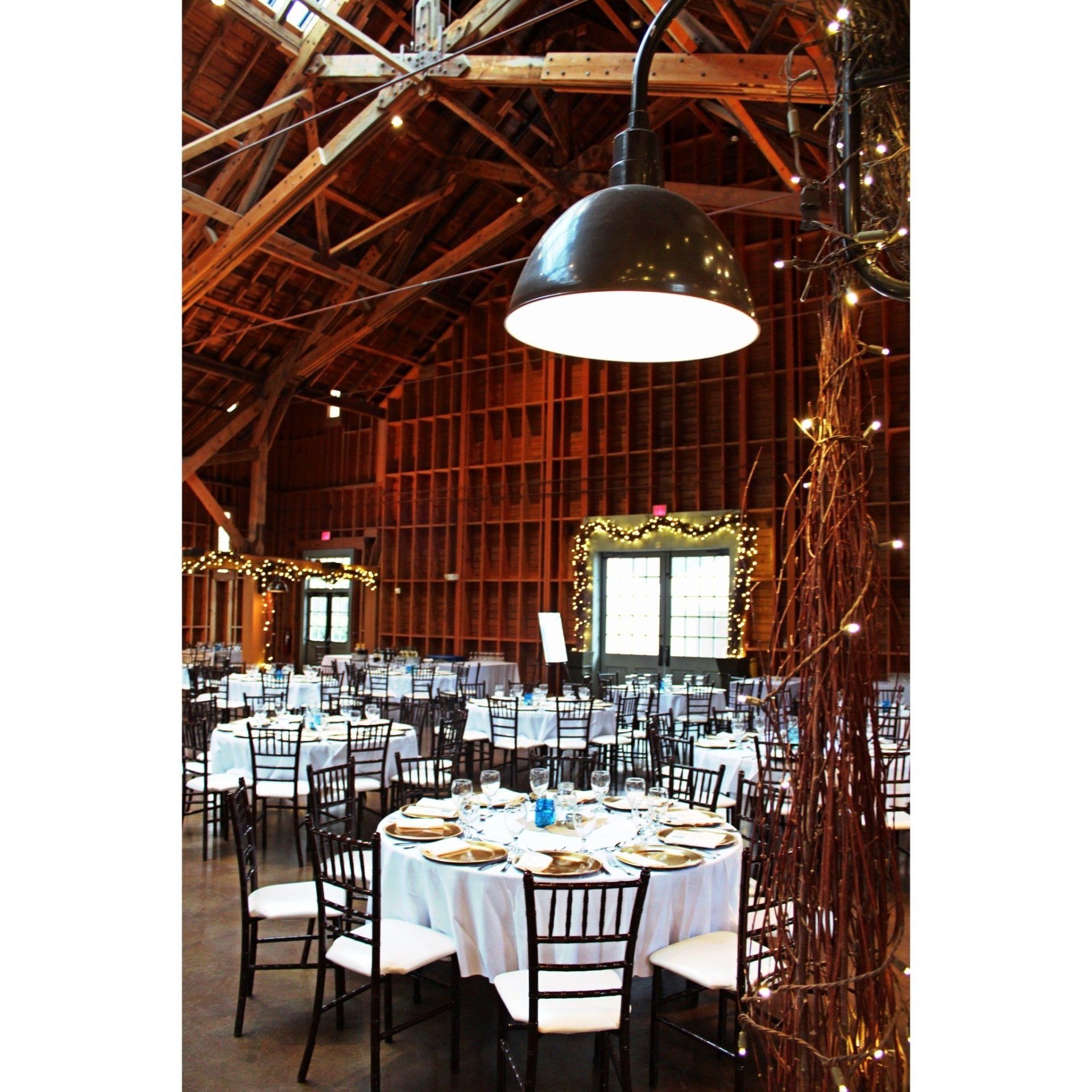 Fair Barn venue set up showing decor and wooden beams