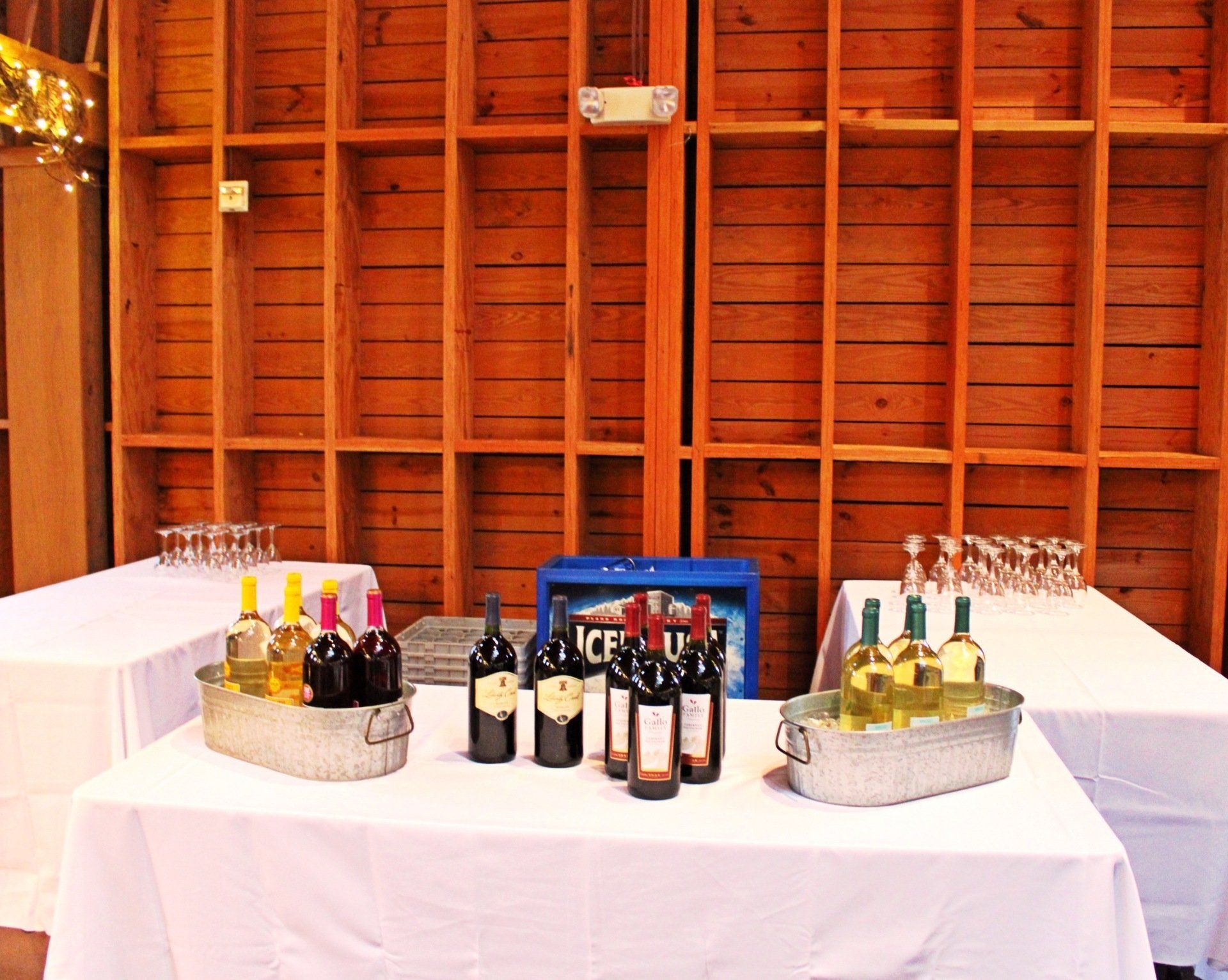 beverage table set up with wine and glasses