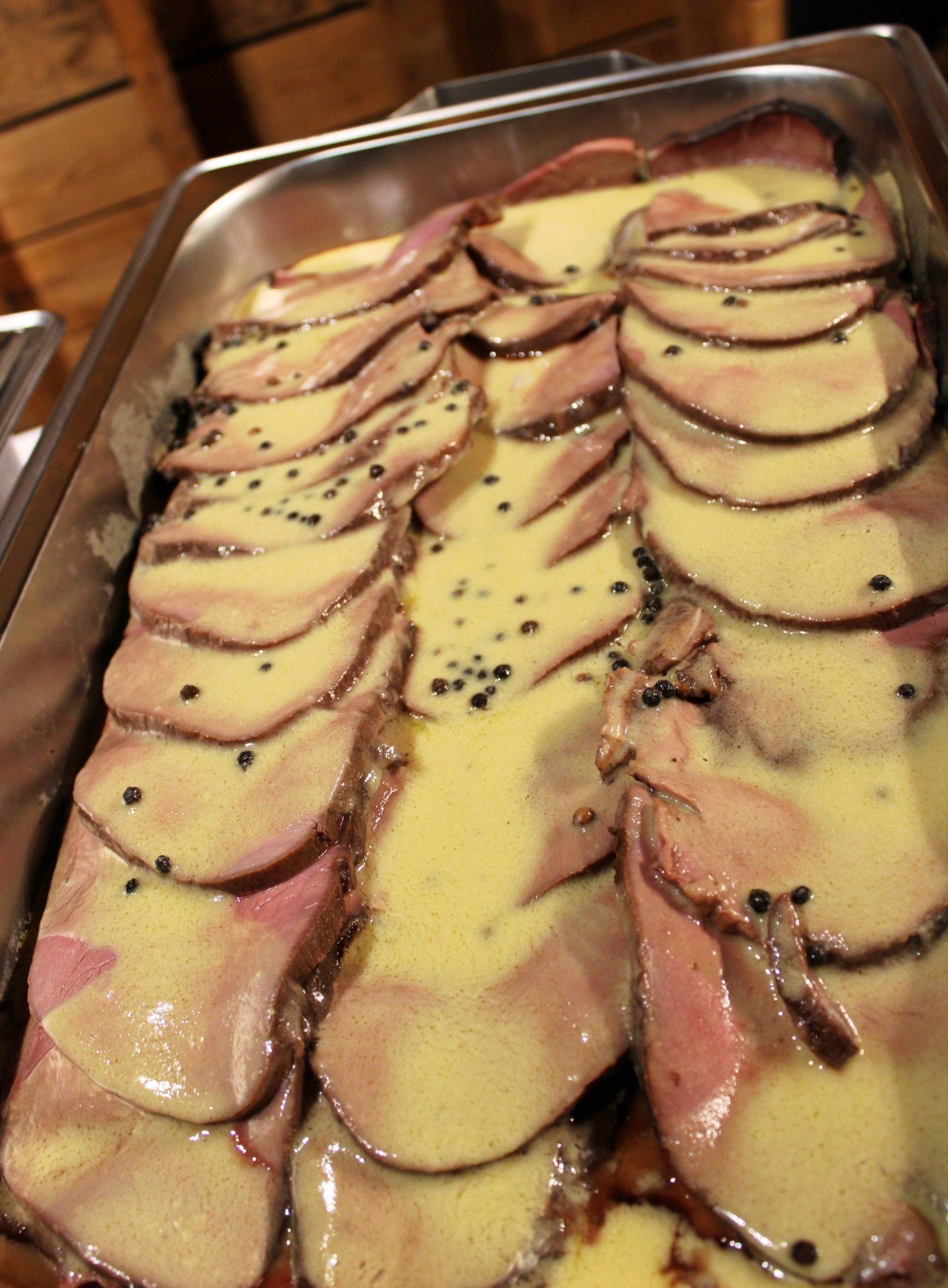buffet pan filled with sliced ham