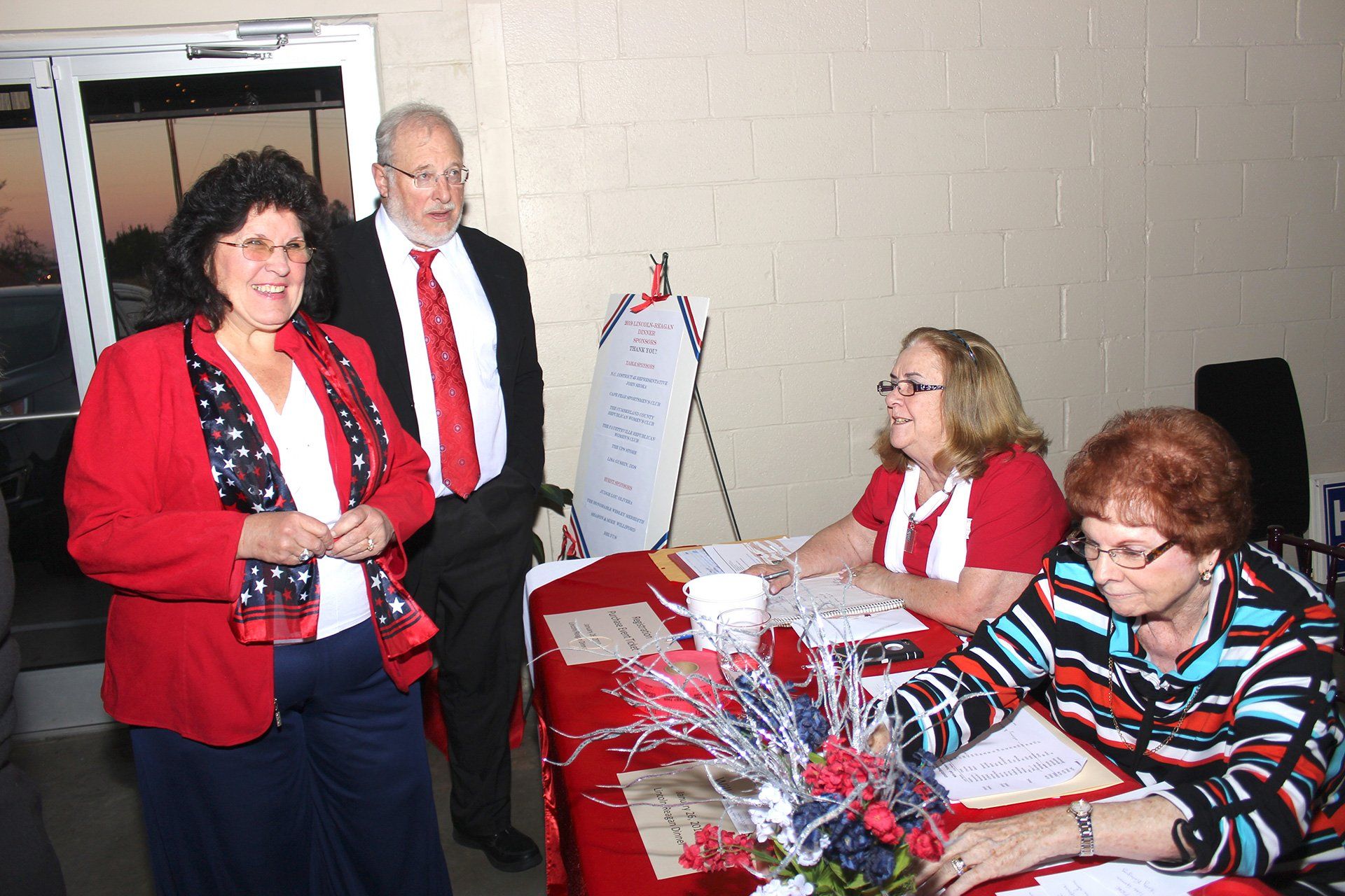 guests entering and being checked in at registration table