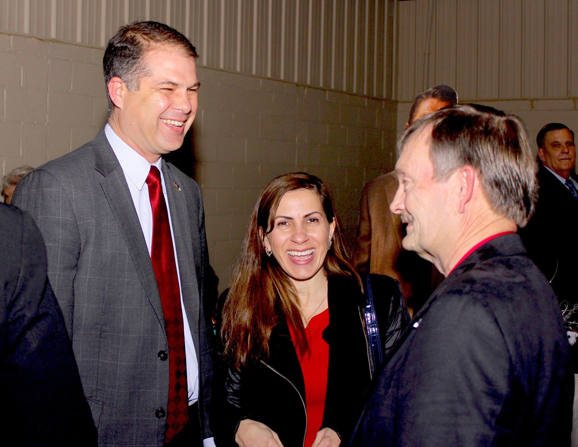 3 guest smiling and conversing