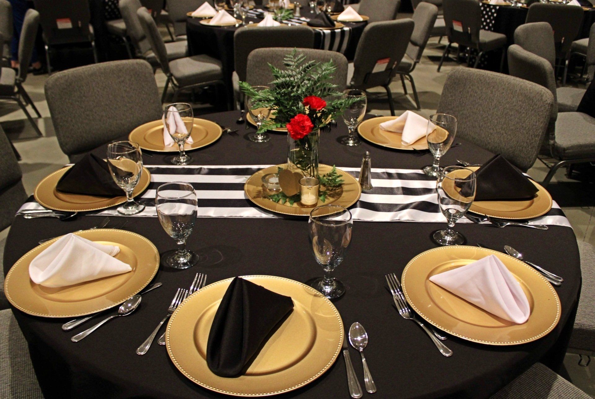 round table set up with gold black and white decor