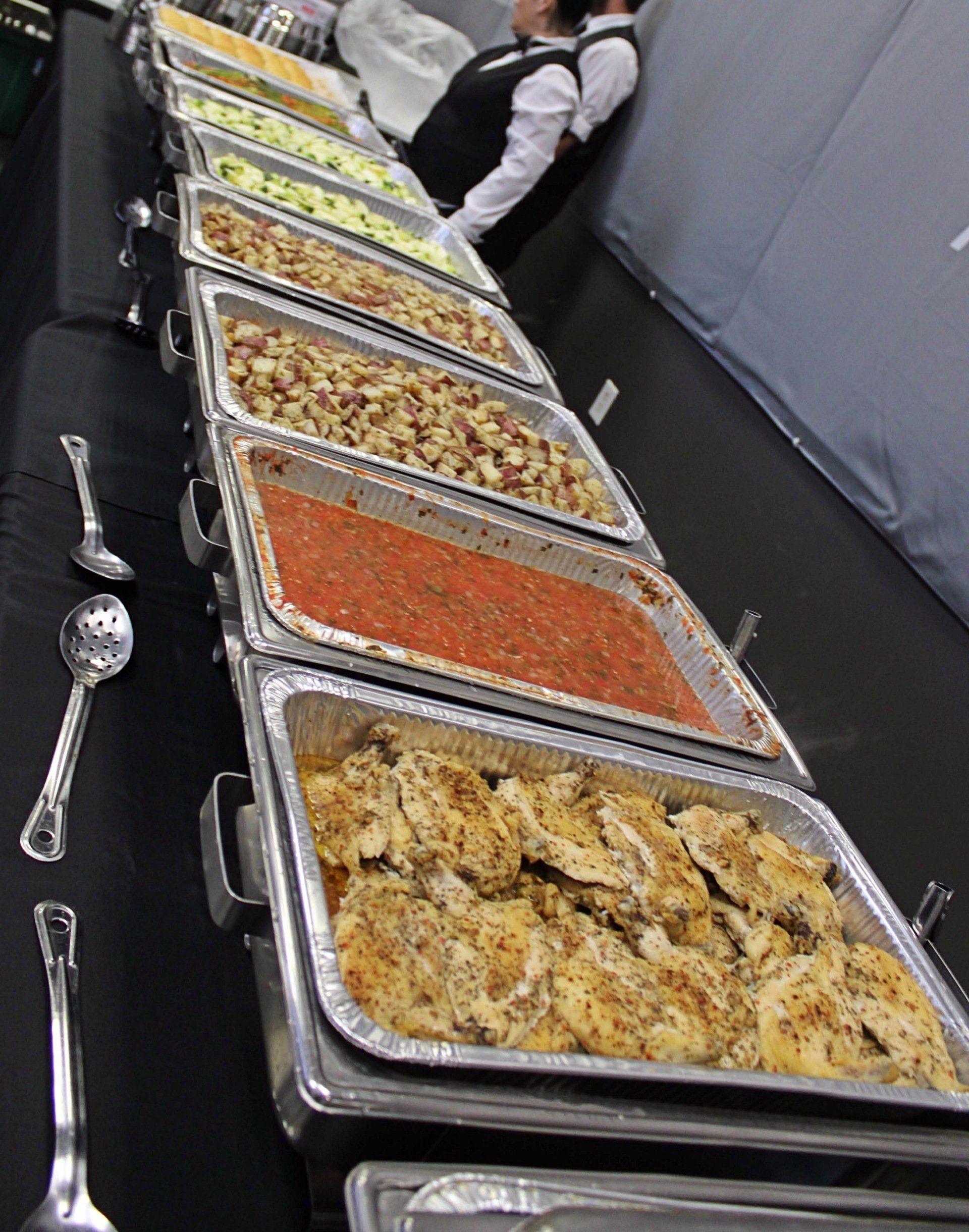 buffet table filled with filled buffet pans at Manna Church venue