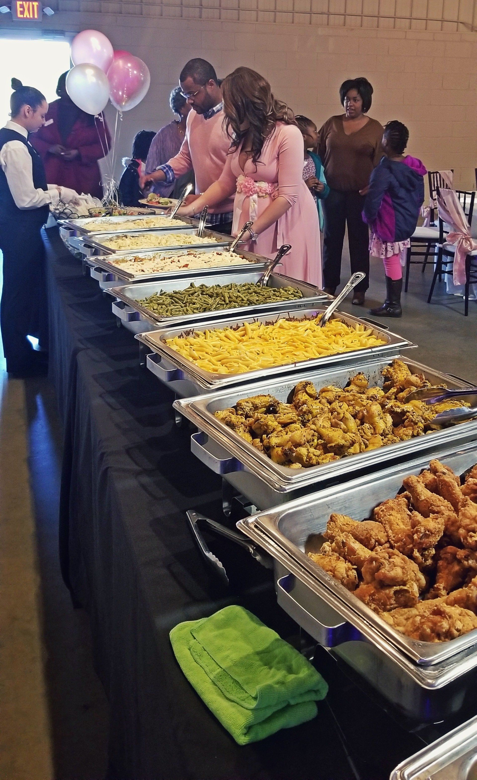 buffet table lined with full buffet pans at Manna Church venue