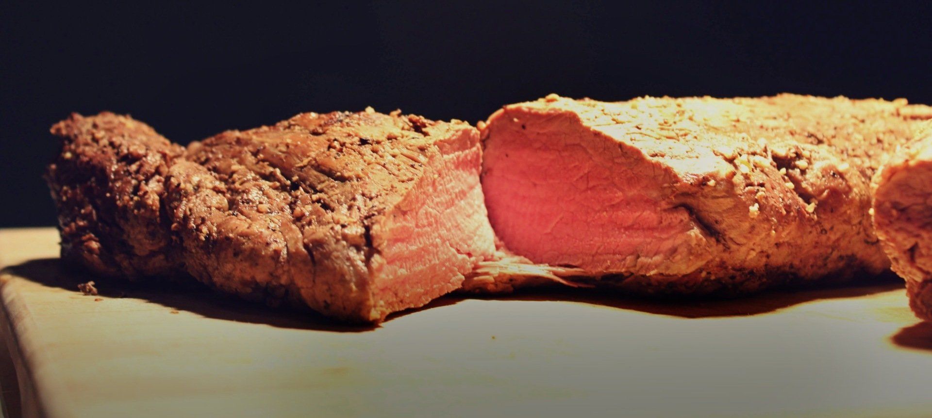 medium rare roast beef on a carving station