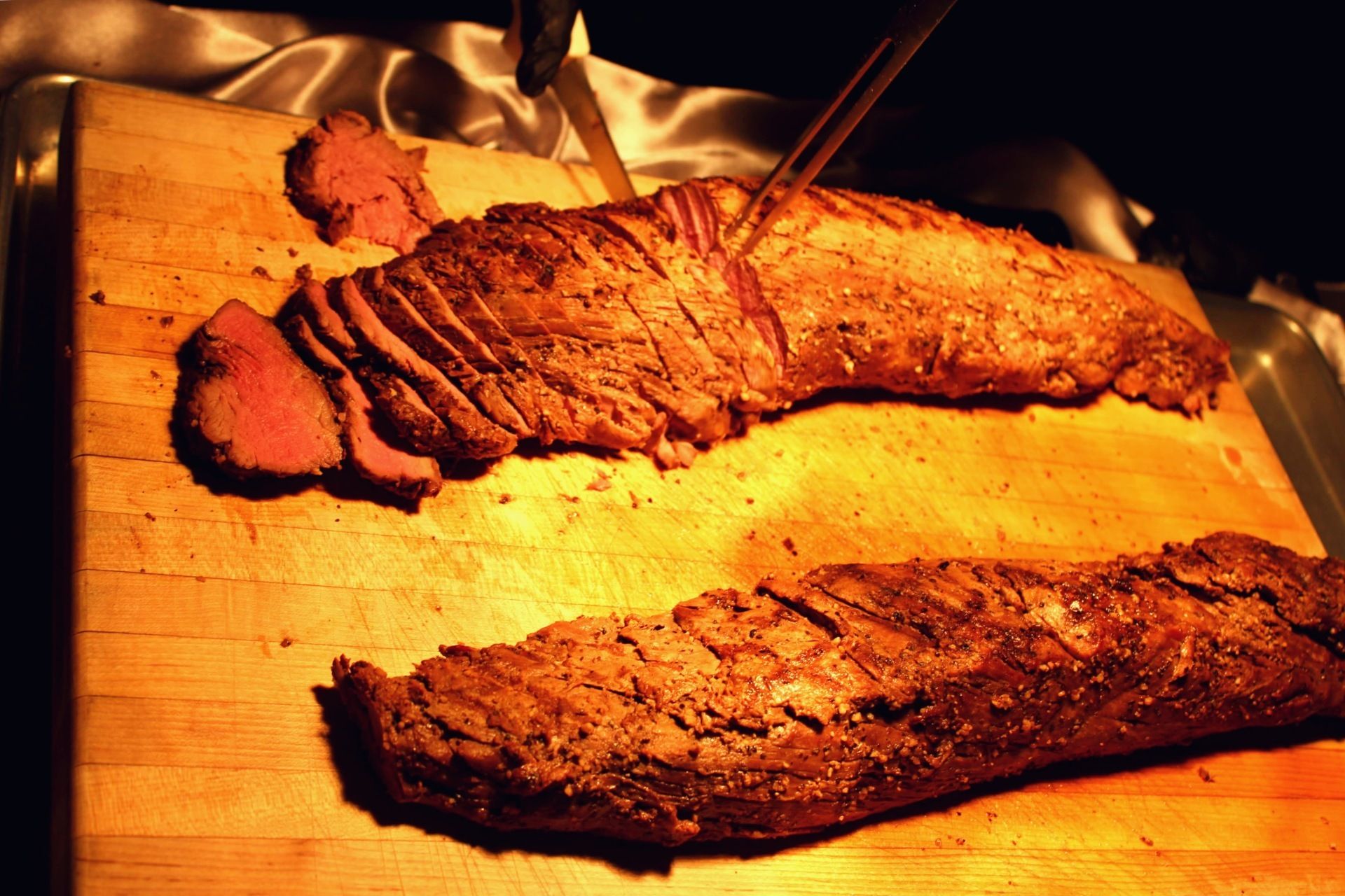 2 large roasts displayed on a carving station