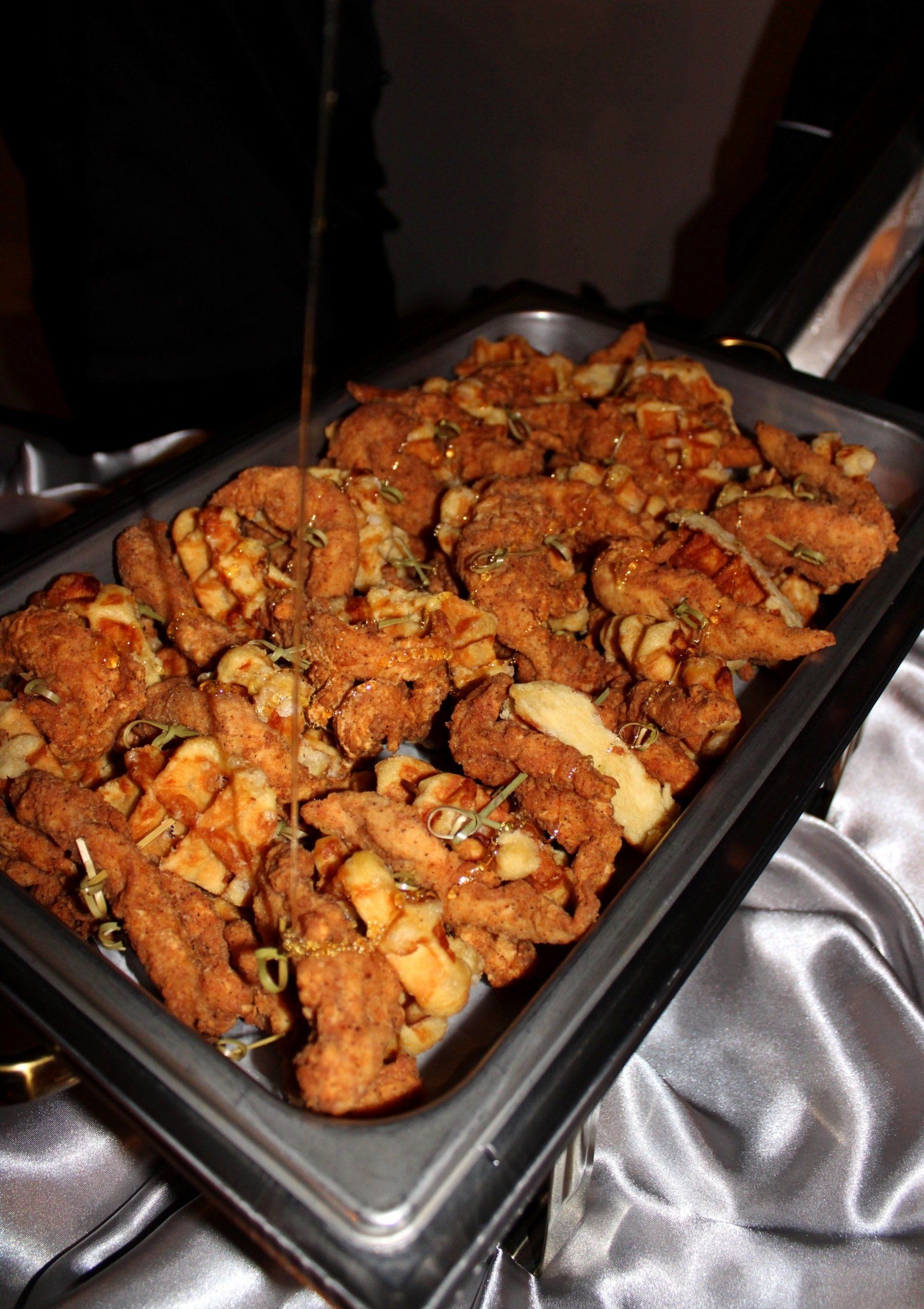 buffet pan filled with fried chicken skewers
