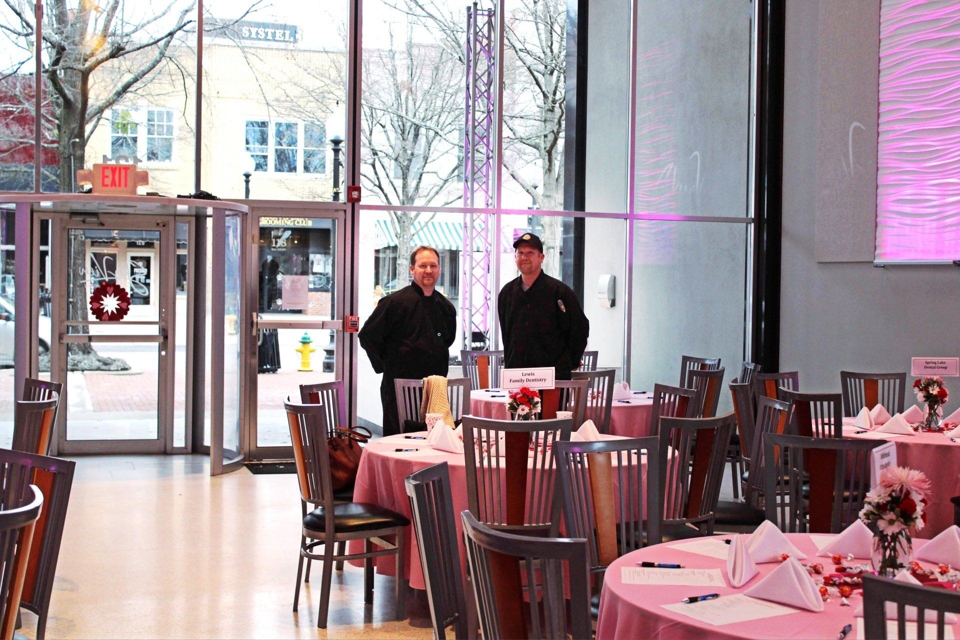 2 male caterers standing in a set up at the Skyview venue