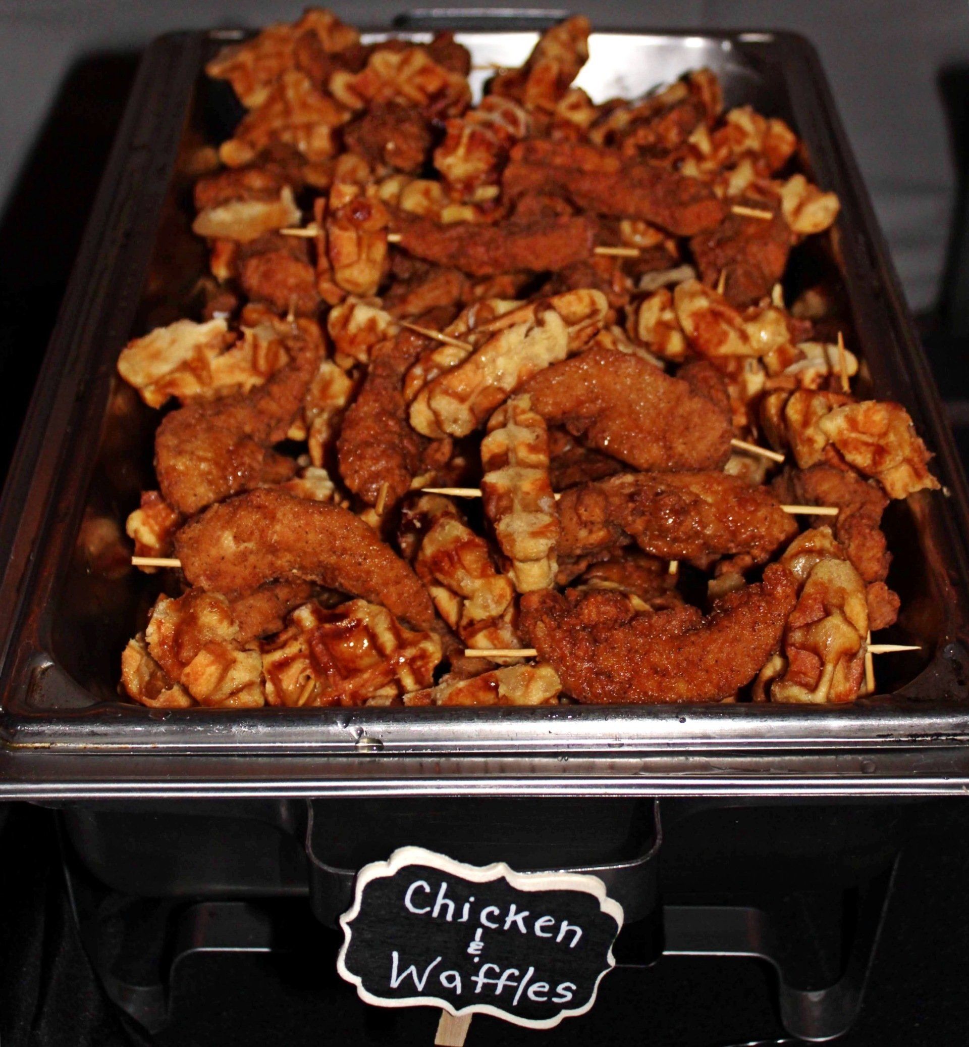 buffet pan filled with chicken and waffles skewers