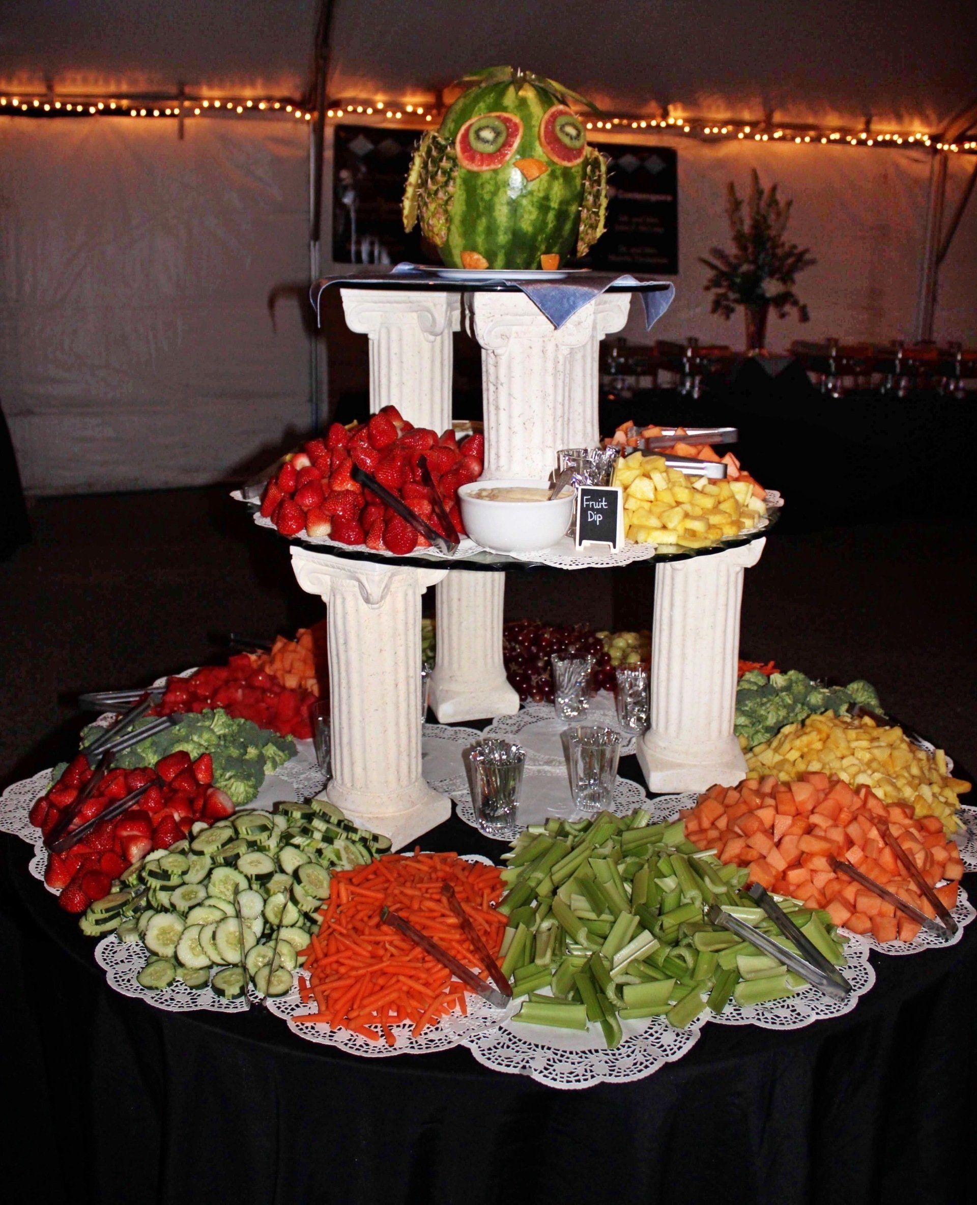 3 tiered fruit and vegetable display with fruit owl dispay on top