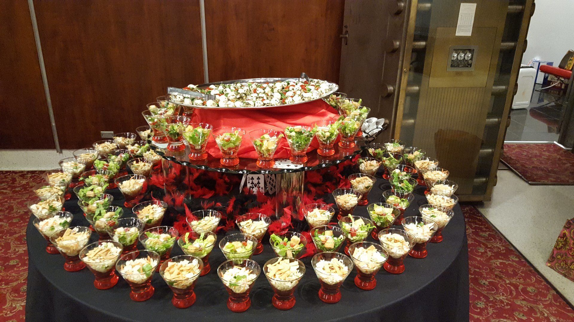 round table set up with appetizers in glass cups