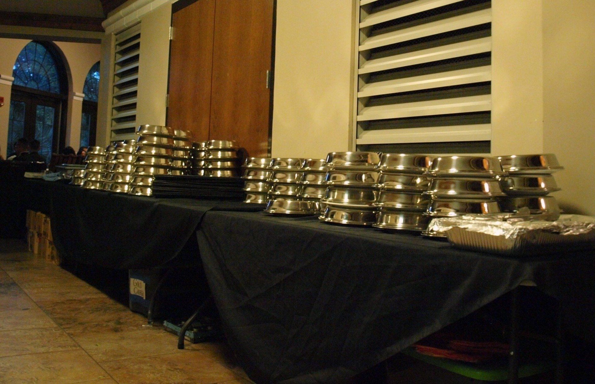 long tables stacked with plated food