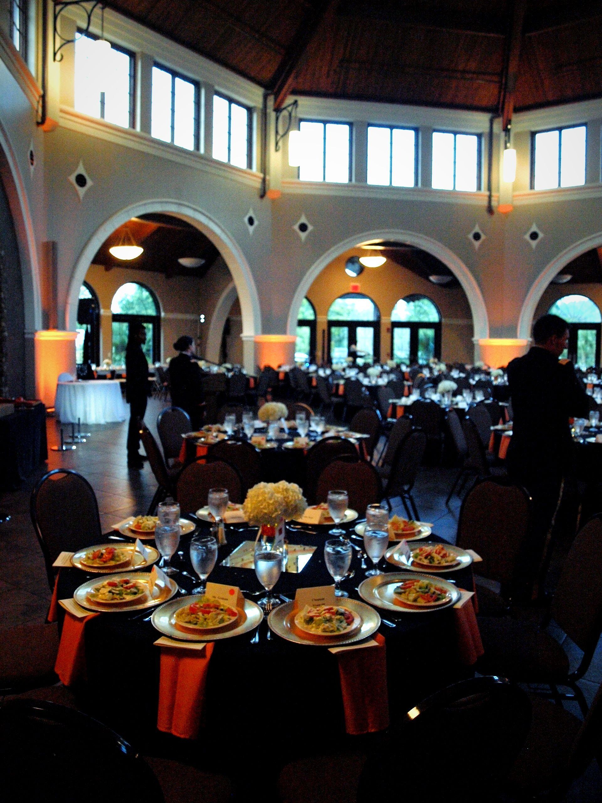 round tables set with plated salads
