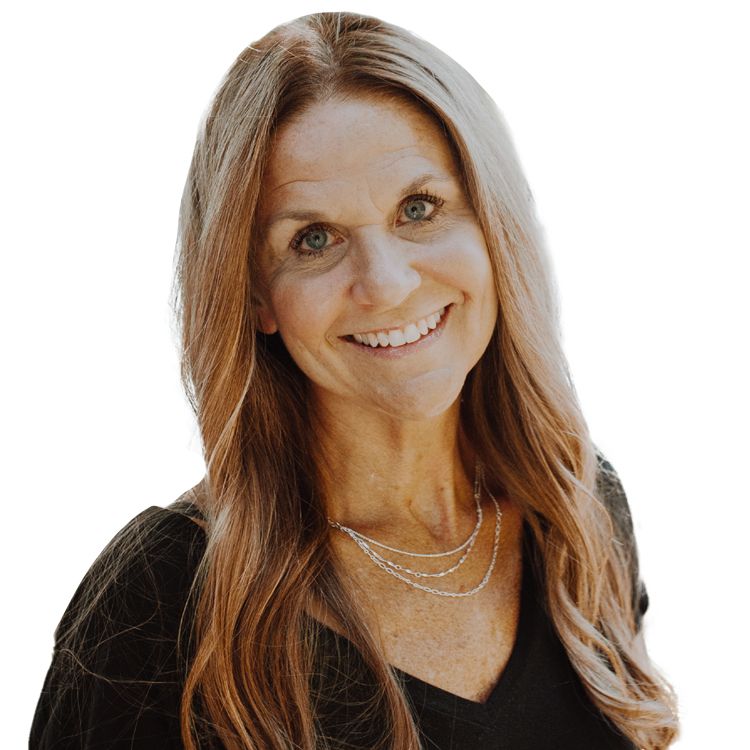 A woman wearing a black shirt and a necklace is smiling for the camera.