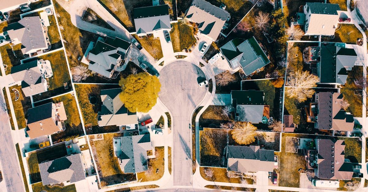 An aerial view of a residential area with lots of houses and trees.